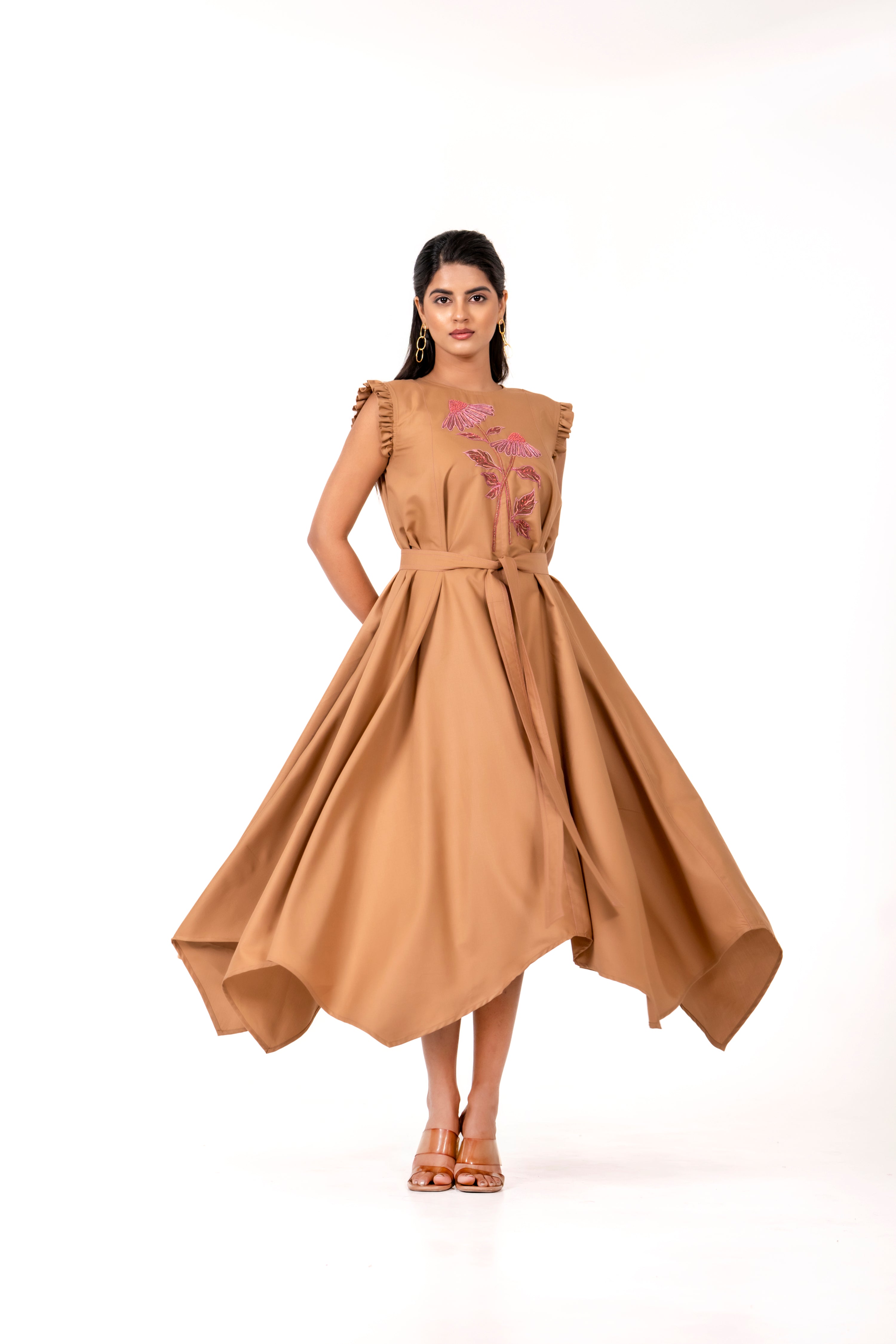 BEIGE HANDKERCHIEF HEM DRESS WITH FLORAL EMBROIDERY.