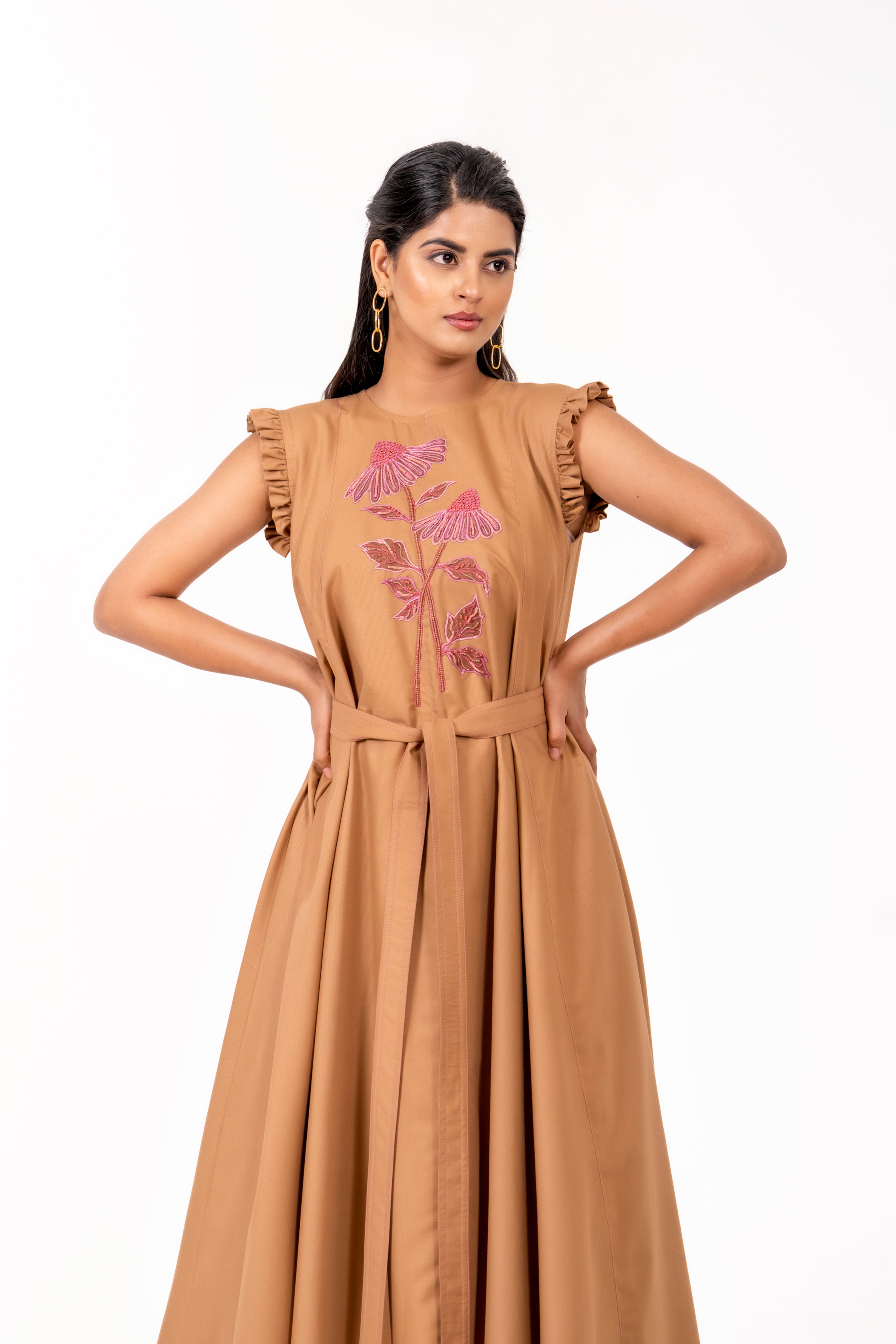 BEIGE HANDKERCHIEF HEM DRESS WITH FLORAL EMBROIDERY.