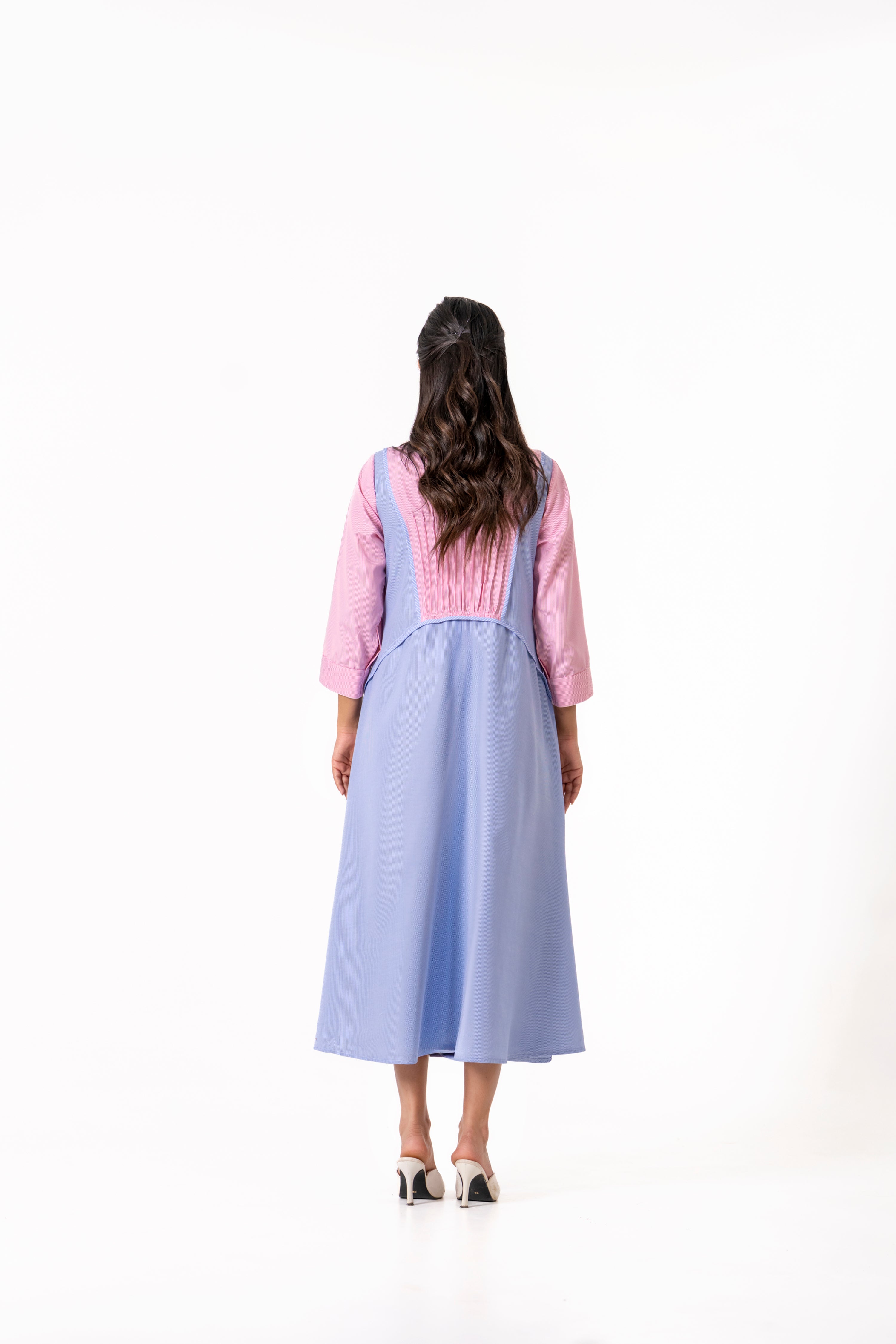 PINK AND BLUE LAYERED DRESS WITH MINIMAL FRONT DETAILING.