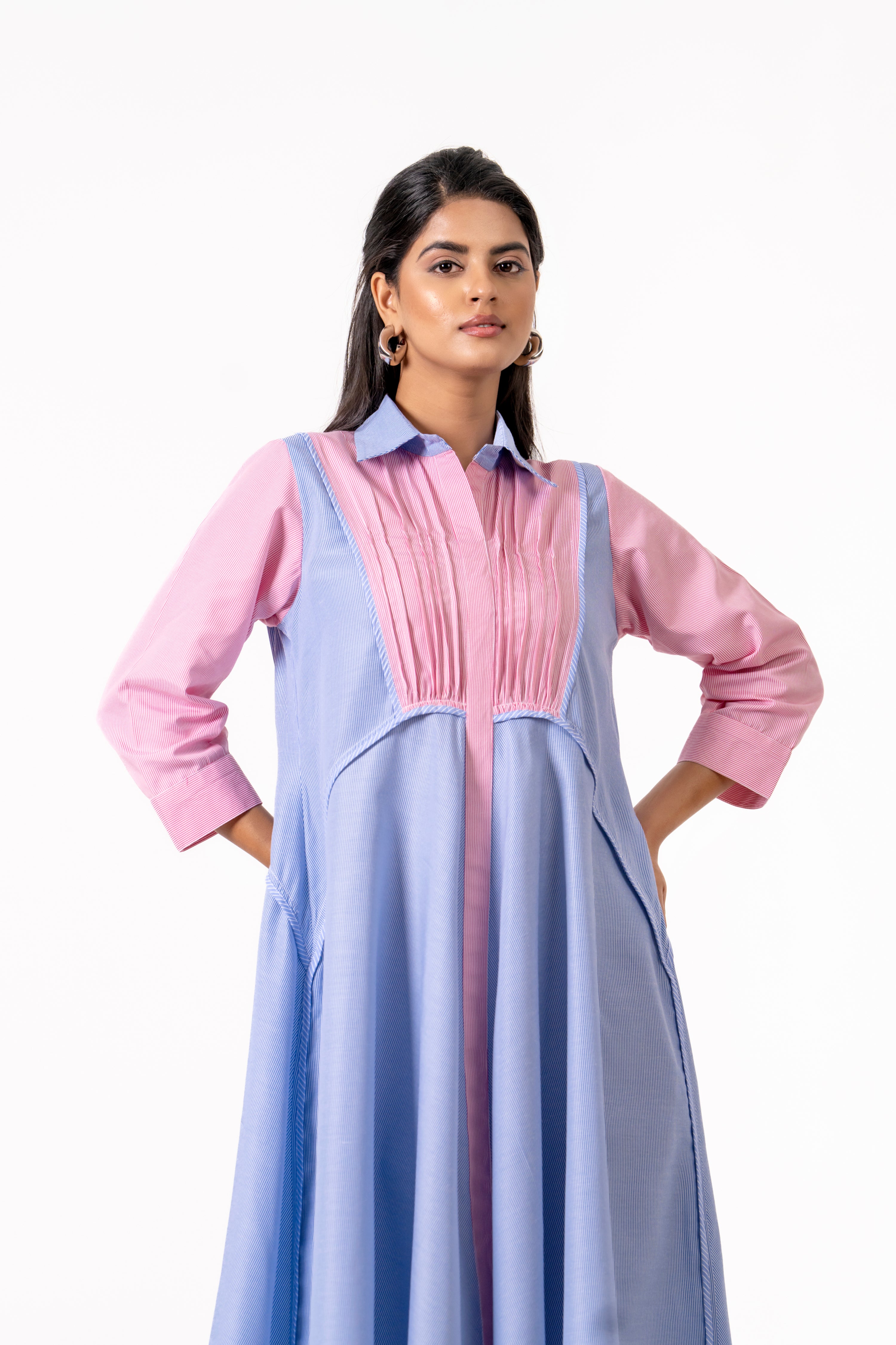 PINK AND BLUE LAYERED DRESS WITH MINIMAL FRONT DETAILING.