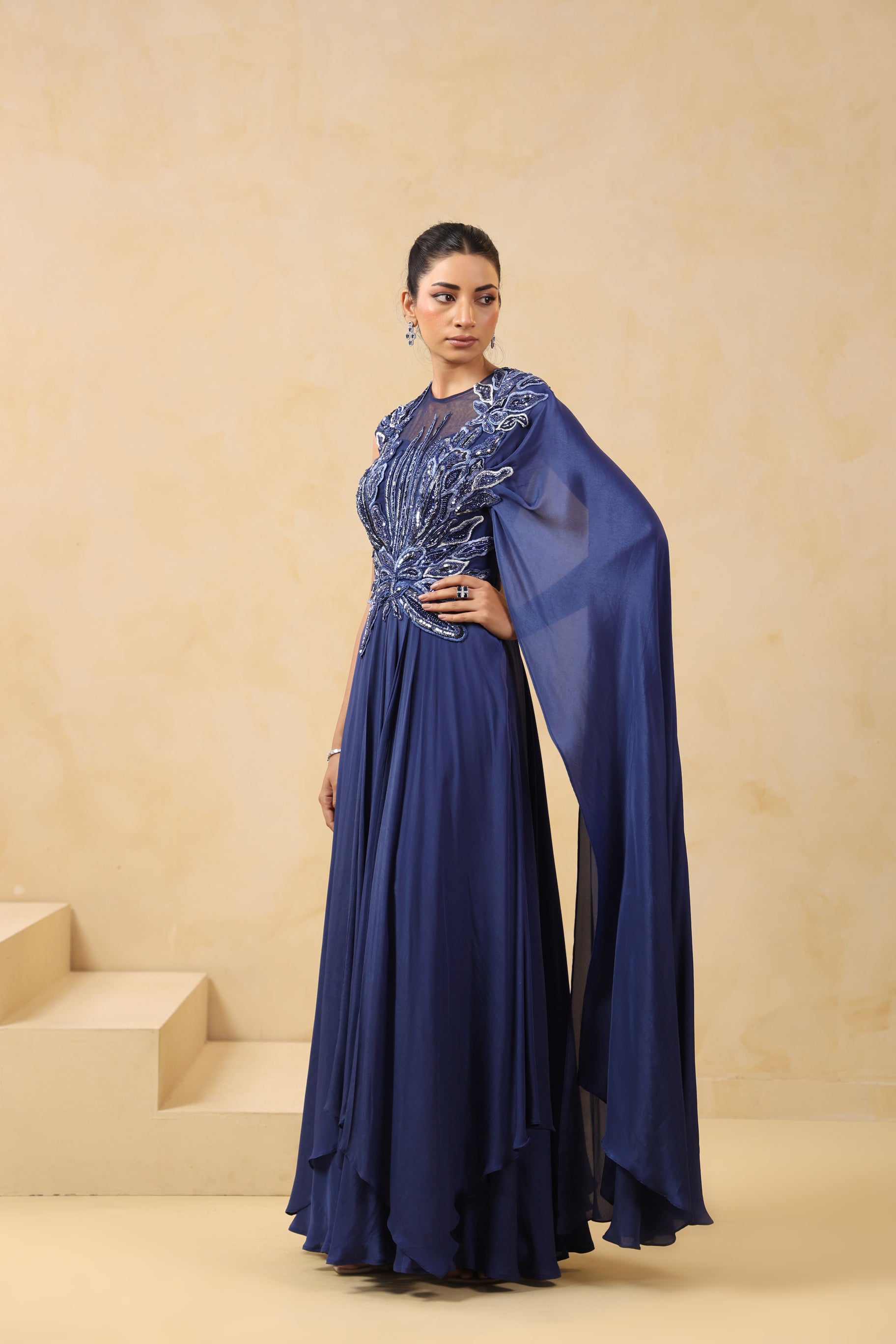 ROYAL BLUE DRAPED SAREE GOWN WITH APPLIQUE EMBROIDERY.