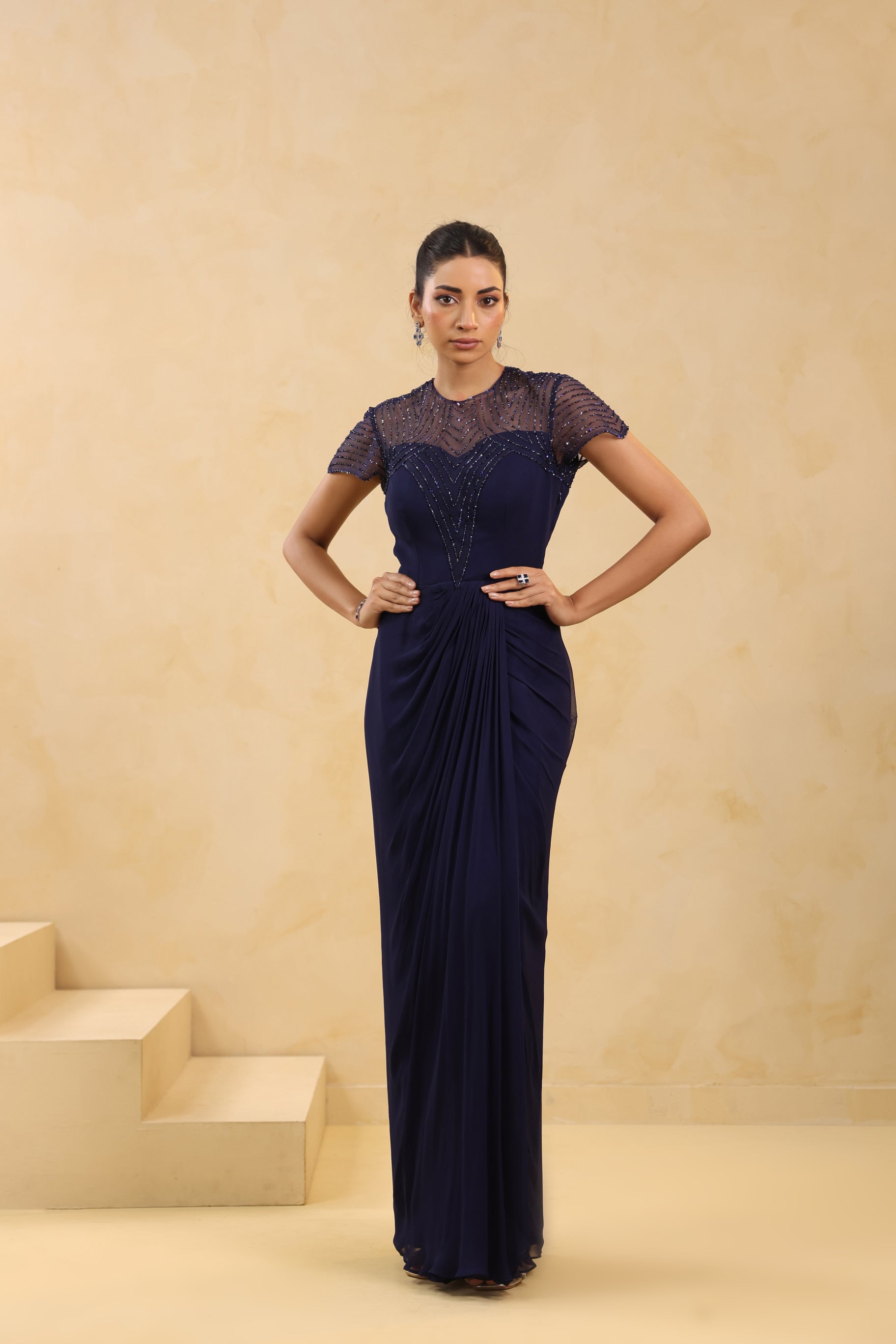 NAVY BLUE EMBELLISHED DRAPED GOWN.