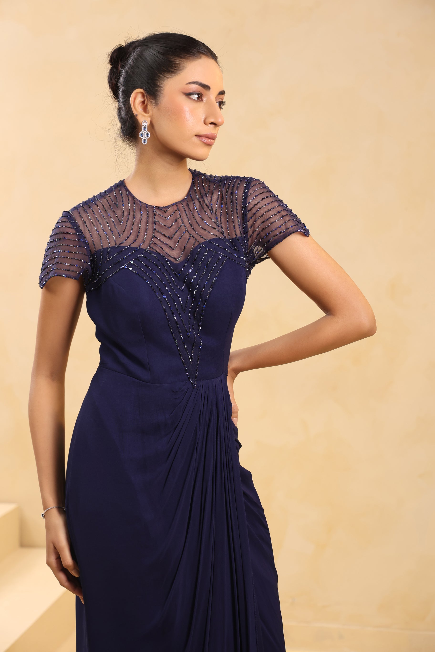 NAVY BLUE EMBELLISHED DRAPED GOWN.