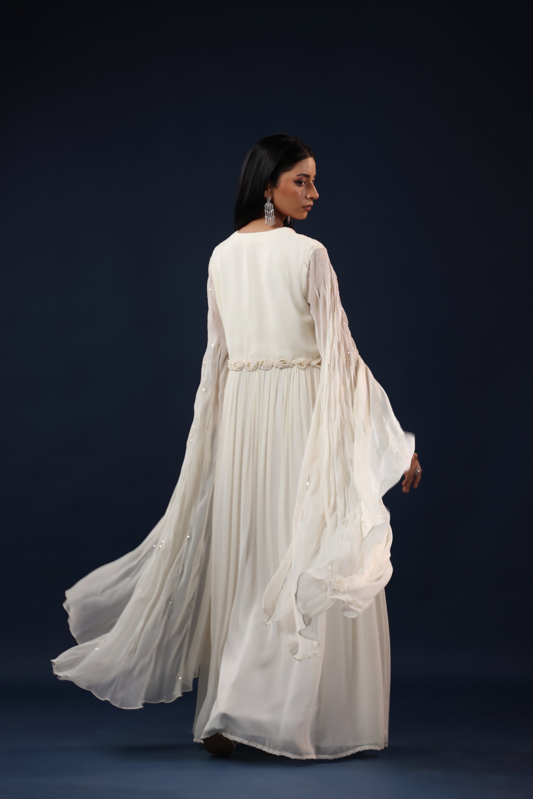 WHITE CAPE GOWN WITH PEARL WAIST WORK.
