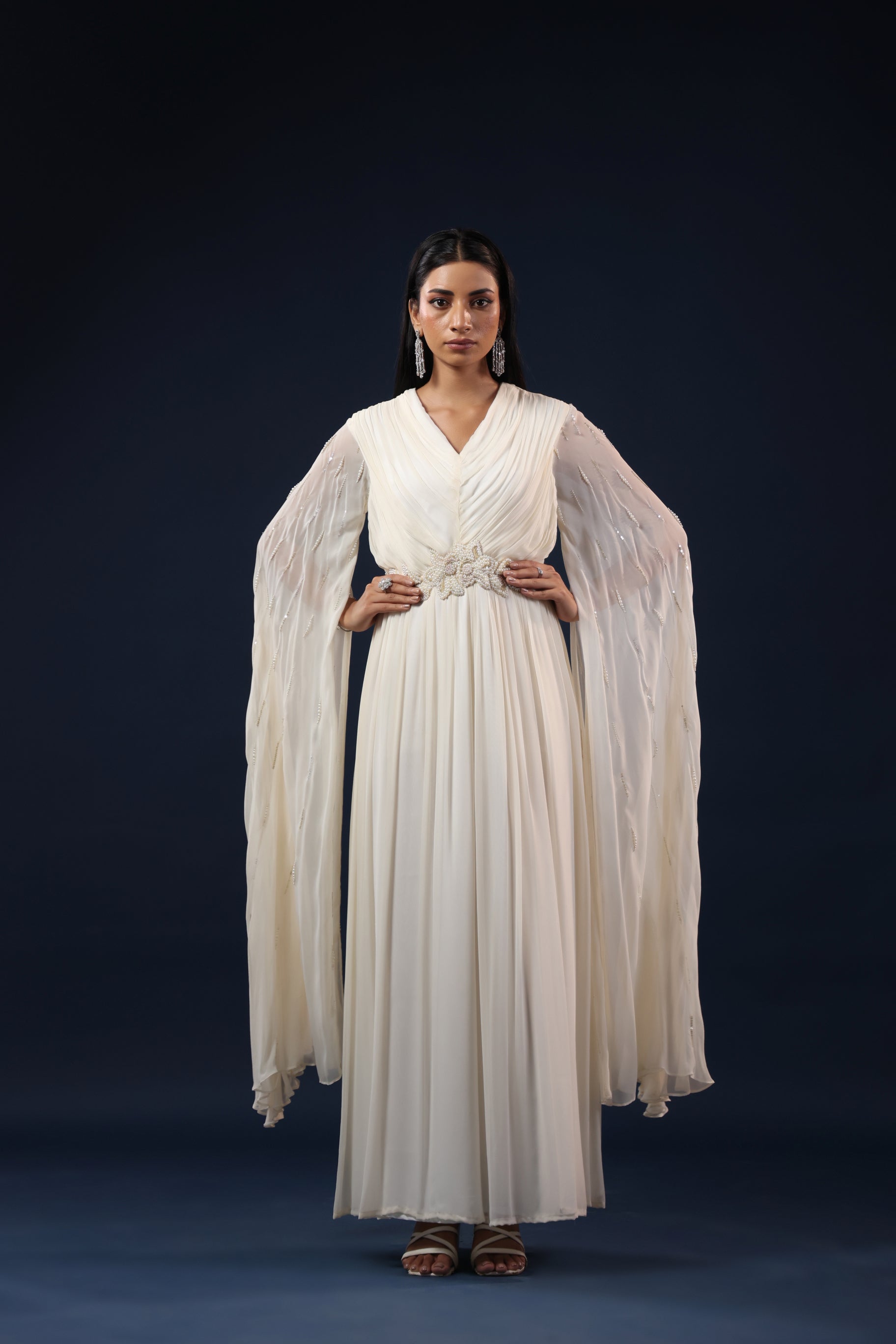 WHITE CAPE GOWN WITH PEARL WAIST WORK.