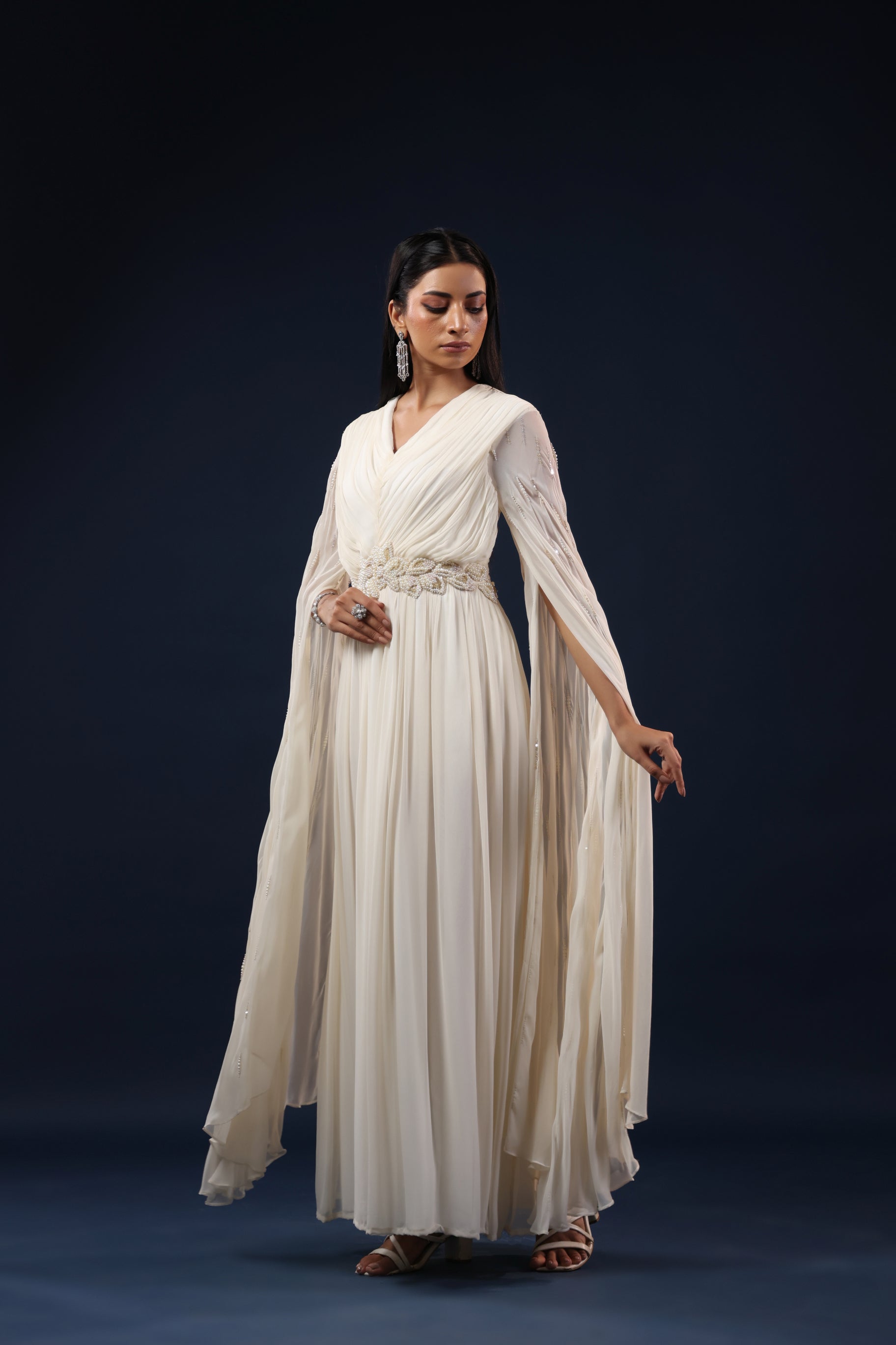 WHITE CAPE GOWN WITH PEARL WAIST WORK.