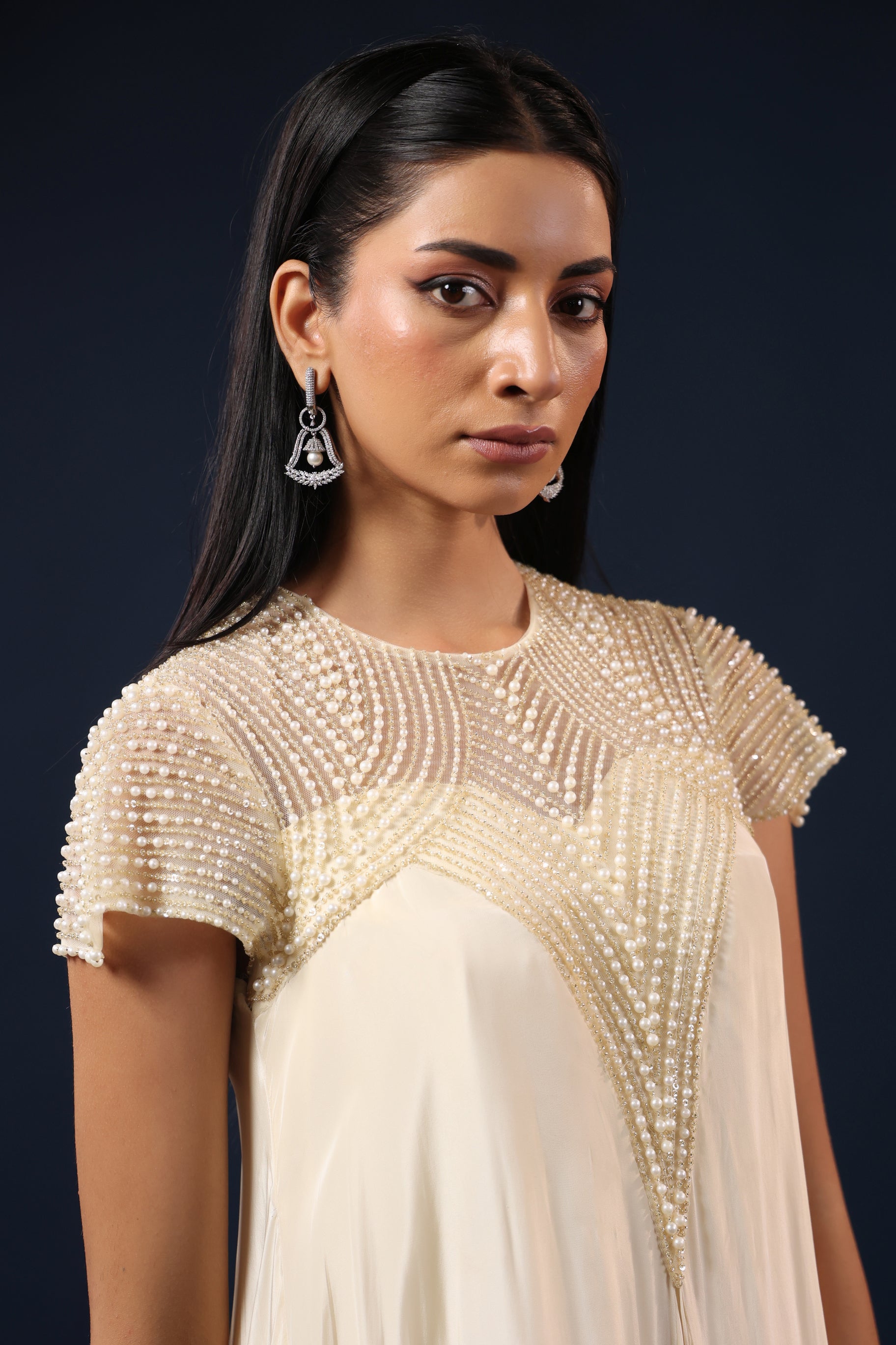 IVORY PEARL EMBELLISHED GOWN.