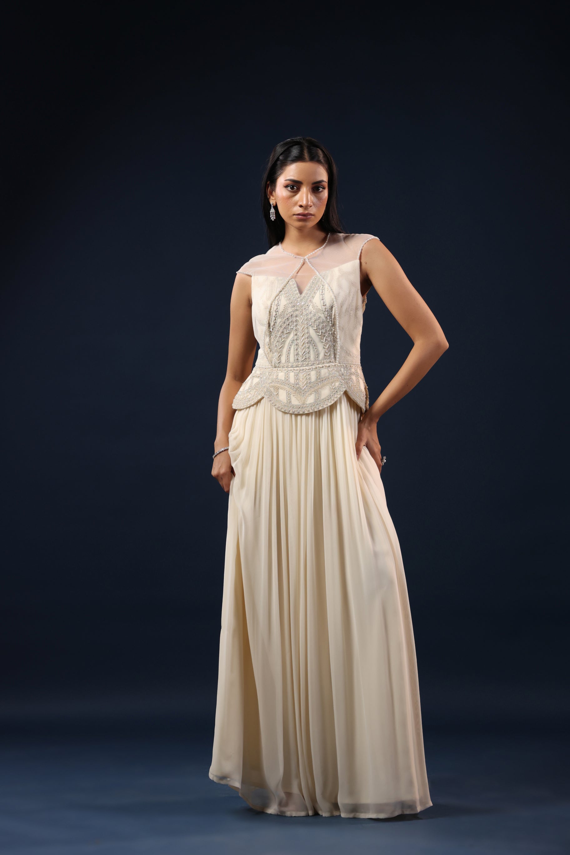 OFF WHITE PEARL EMBELLISHED PEPLUM GOWN.