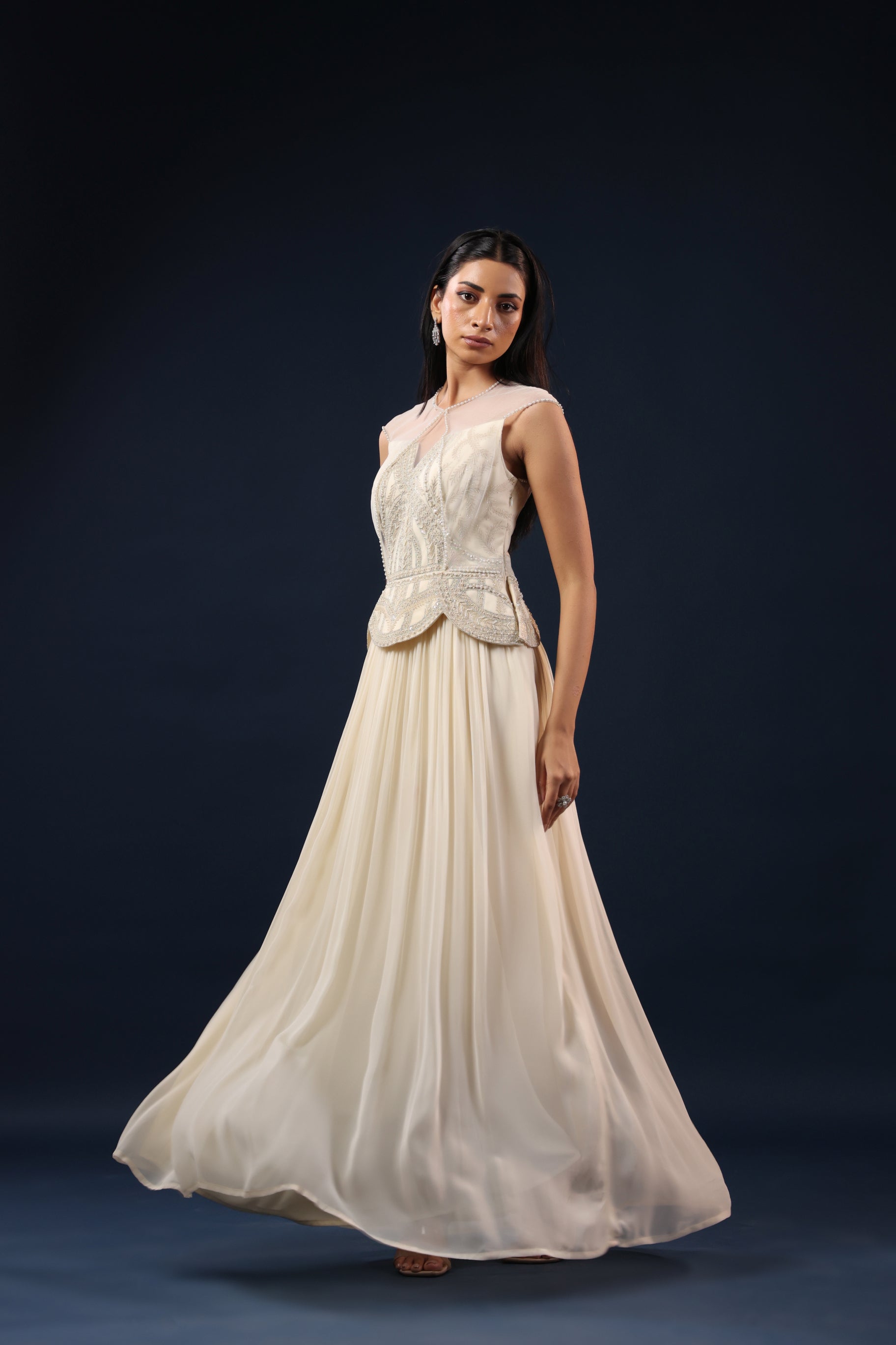 OFF WHITE PEARL EMBELLISHED PEPLUM GOWN.