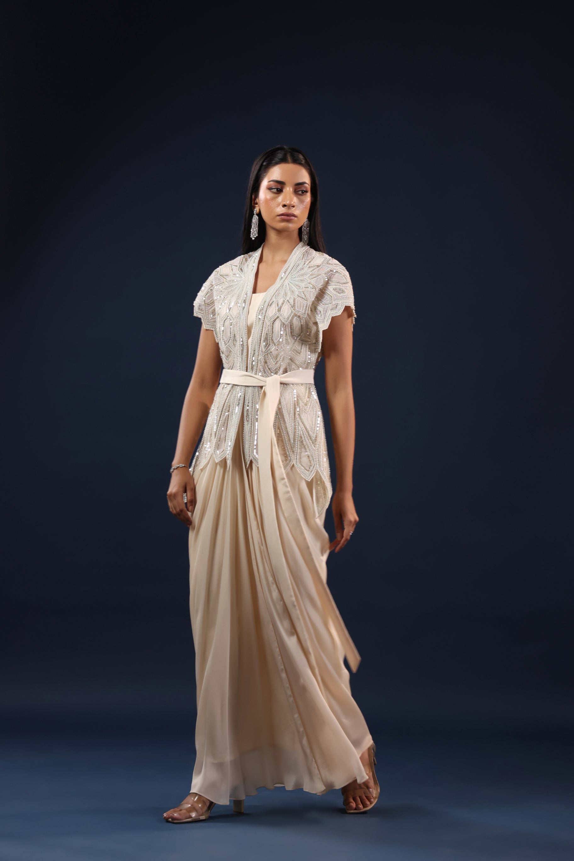 OFF WHITE SKIRT & TOP WITH EMBELLISHED BELTED JACKET.