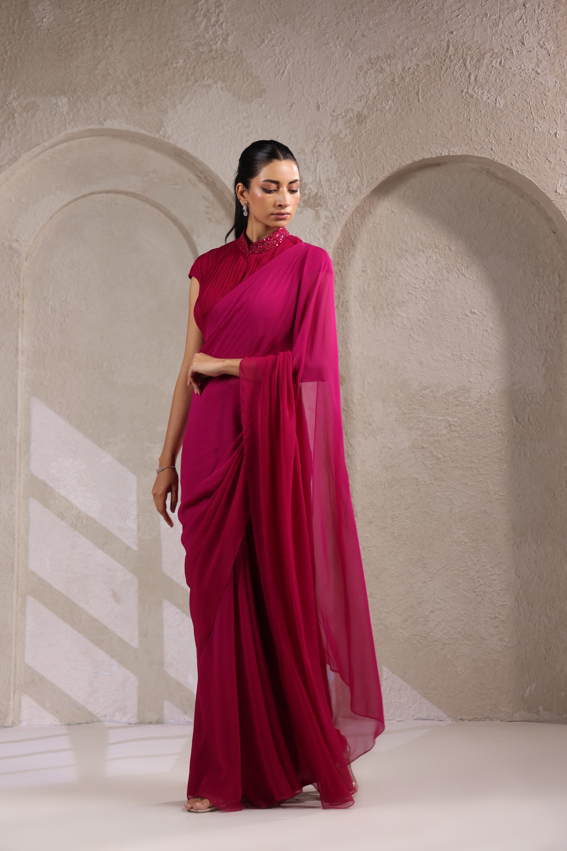 MAGENTA PINK OMBRE GEORGETTE SAREE WITH PLEATED HIGH NECK BLOUSE.