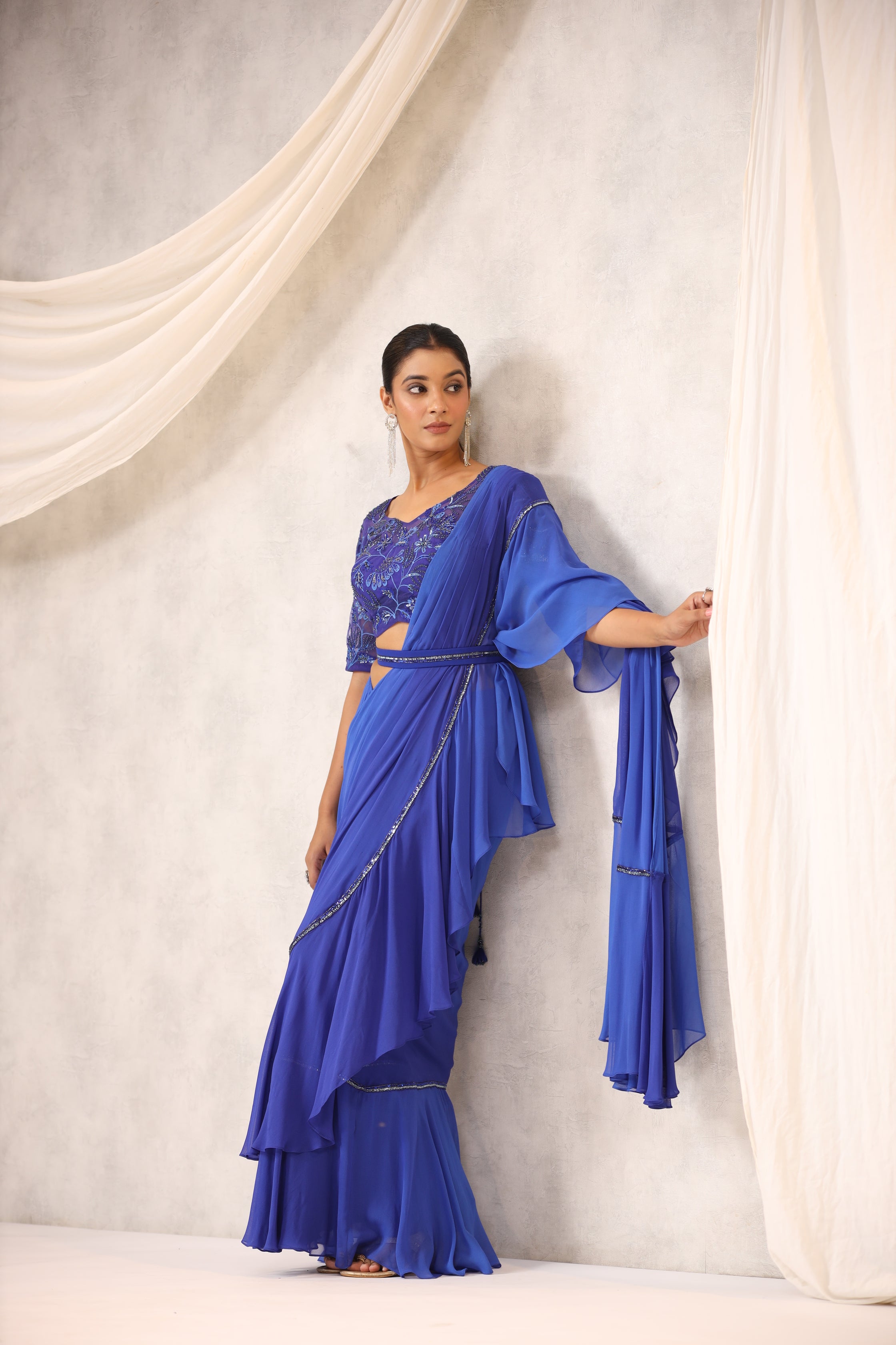 ELECTRIC BLUE GEORGETTE RUFFLE DRAPED SAREE WITH FLORAL BLOUSE
