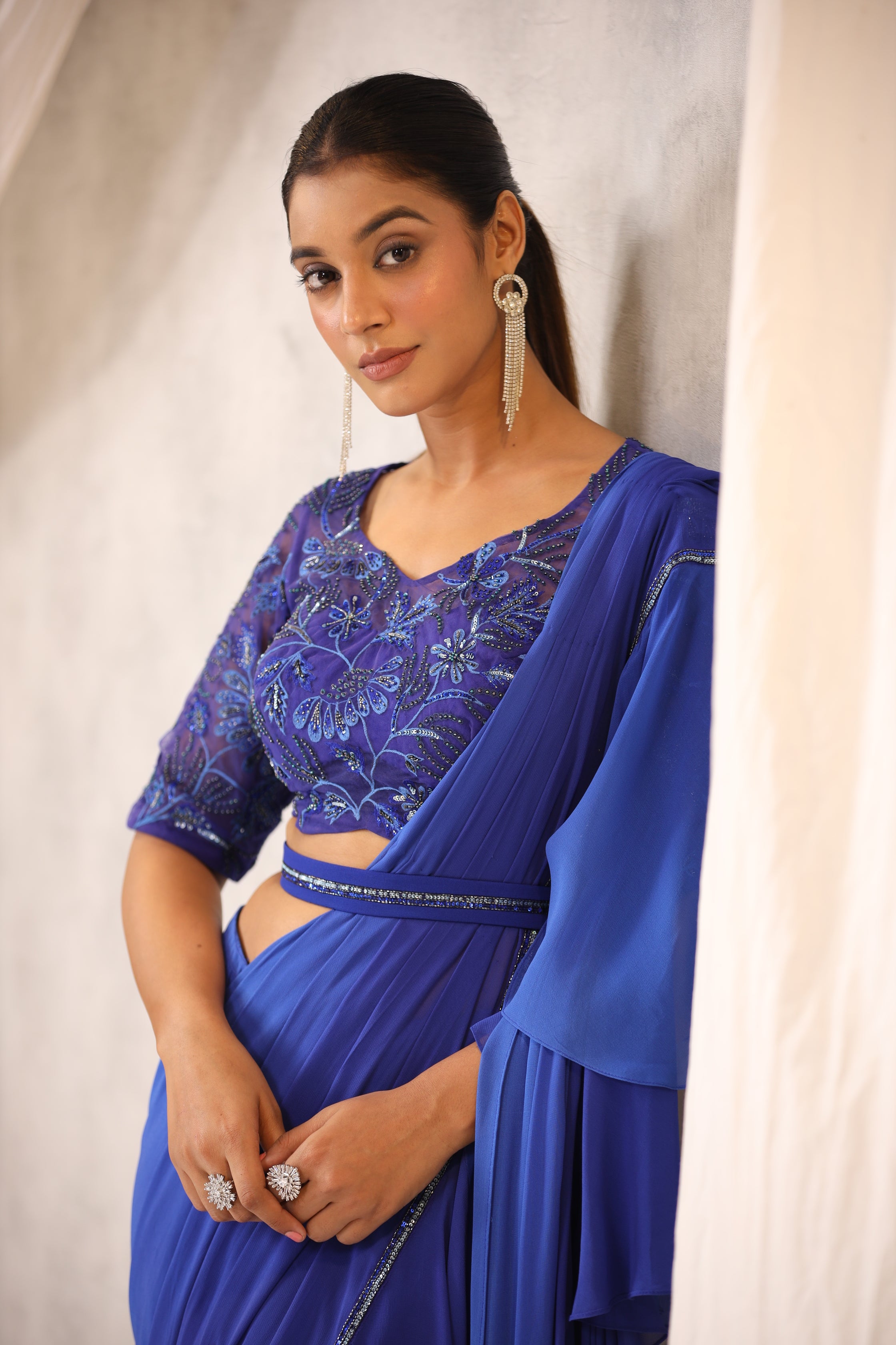 ELECTRIC BLUE GEORGETTE RUFFLE DRAPED SAREE WITH FLORAL BLOUSE
