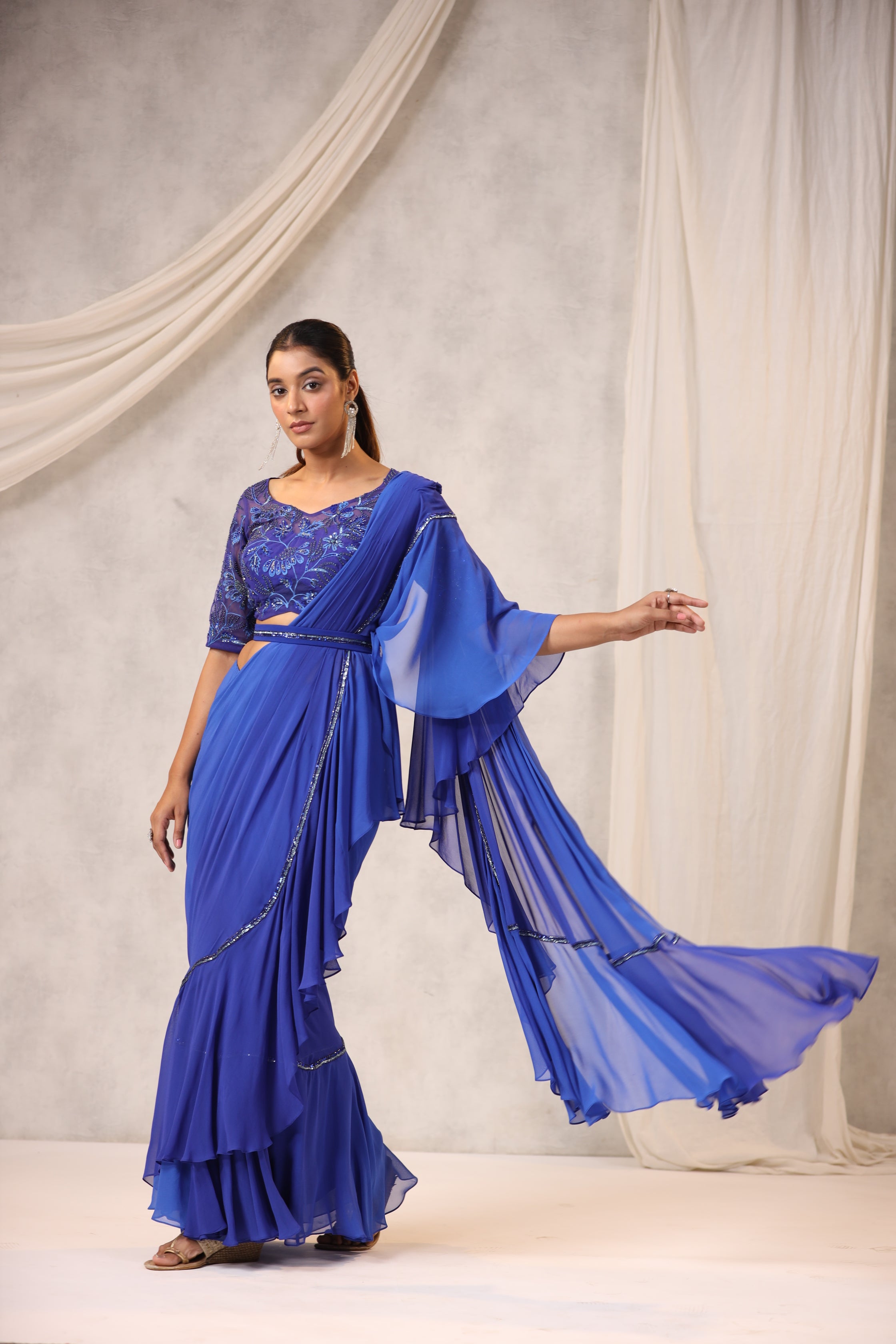 ELECTRIC BLUE GEORGETTE RUFFLE DRAPED SAREE WITH FLORAL BLOUSE