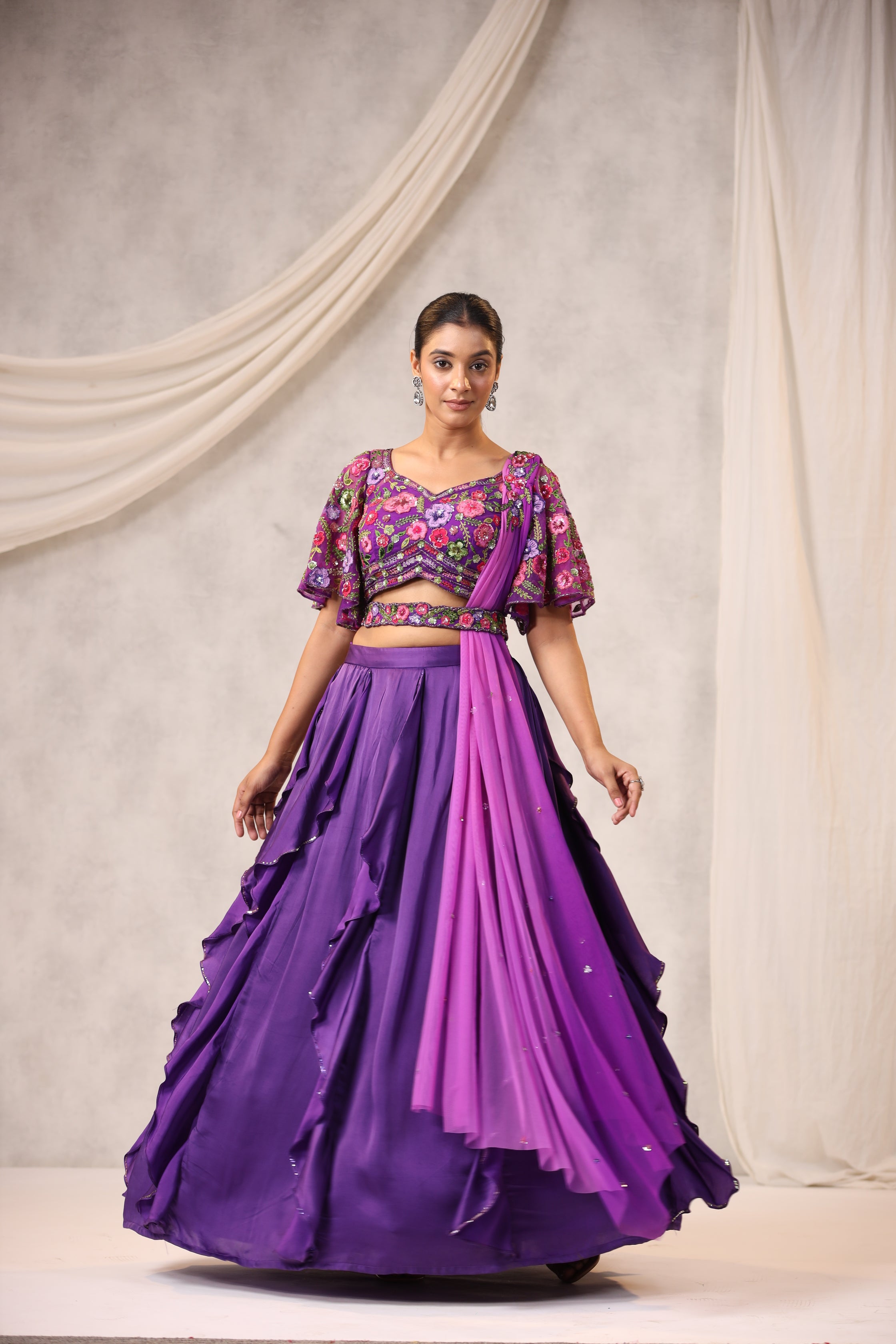 PURPLE RUFFLE LEHENGA WITH AN EMBROIDERED FLORAL BLOUSE