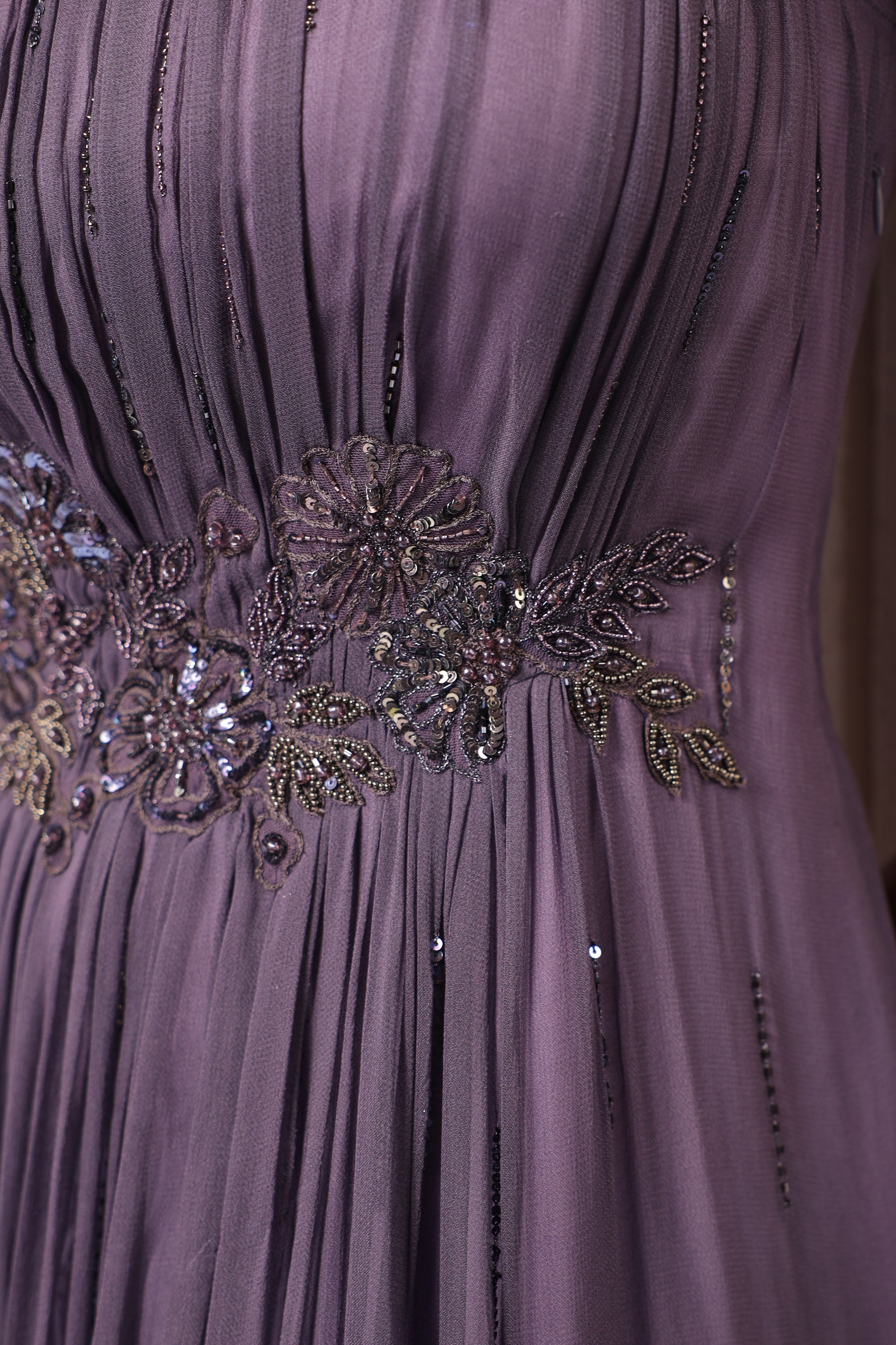 VOILET GEORGETTE GOWN WITH APPLIQUE FLOWERS AT THE WAIST