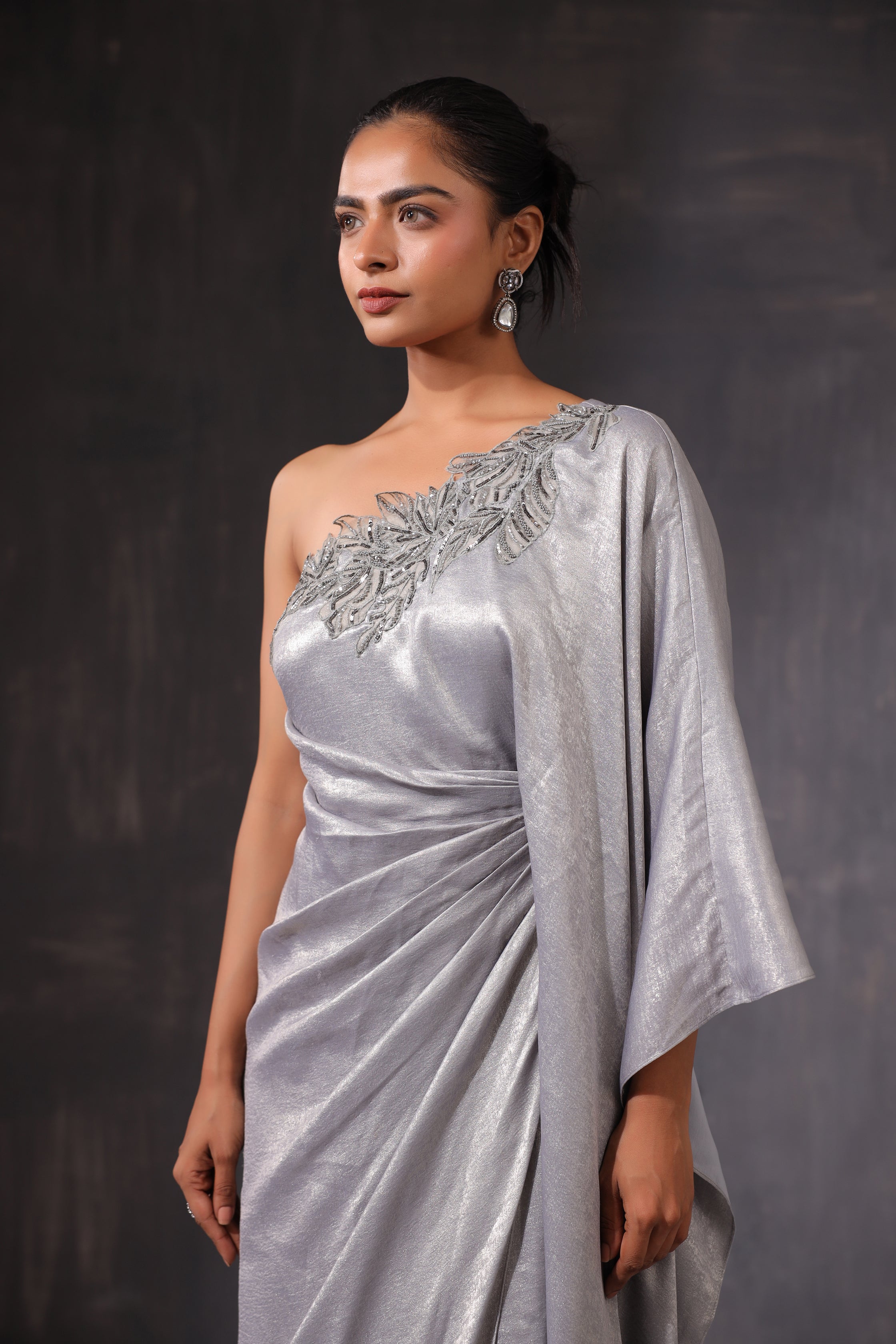 GREY SHIMMER ONE SHOULDER DRAPED GOWN WITH 3D APPLIQUE WORK