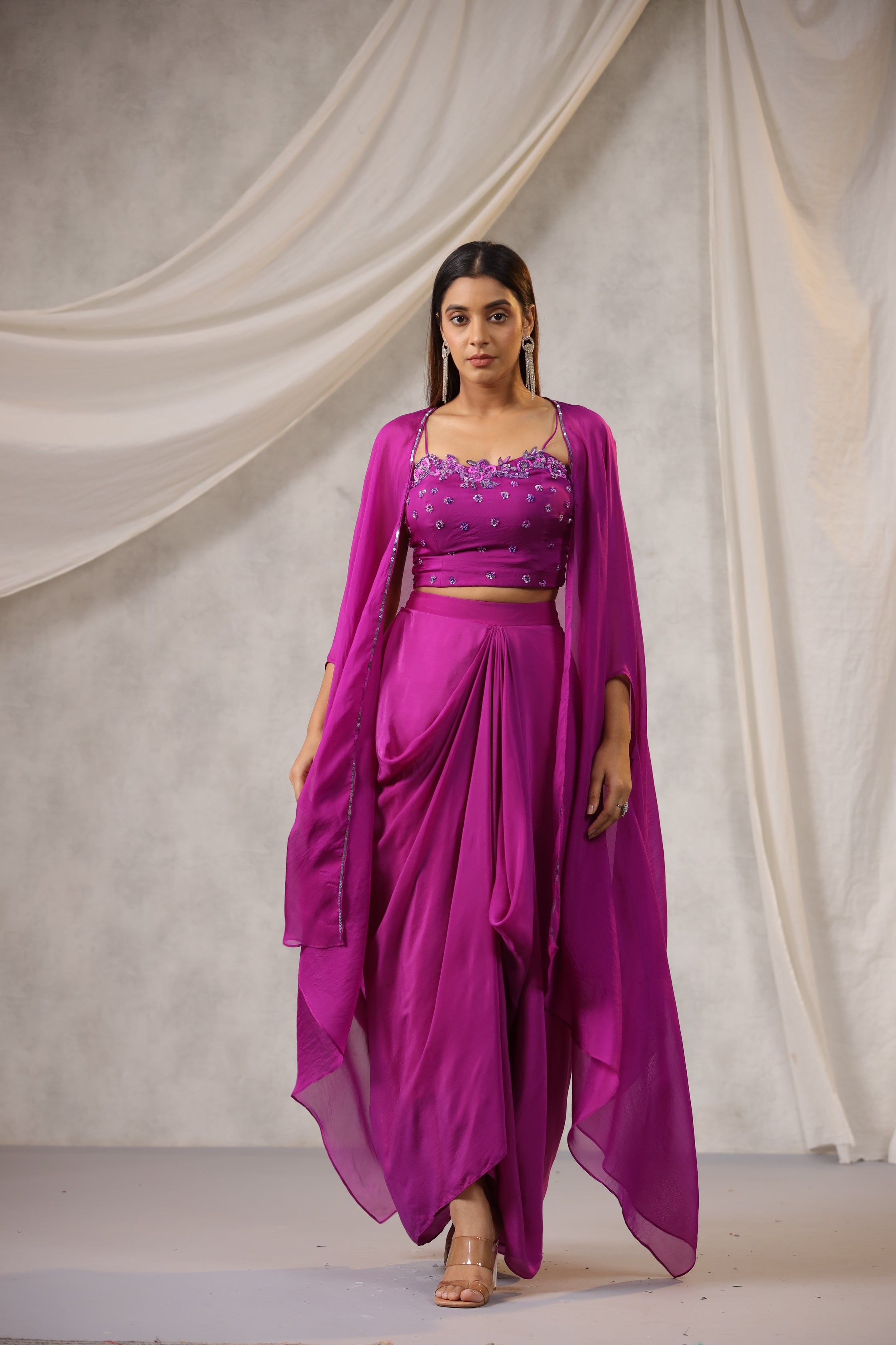 PURPLE EMBROIDERED BUSTIER WITH DRAPED SKIRT AND ORGANZA CAPE AND HAND WORK EDGING