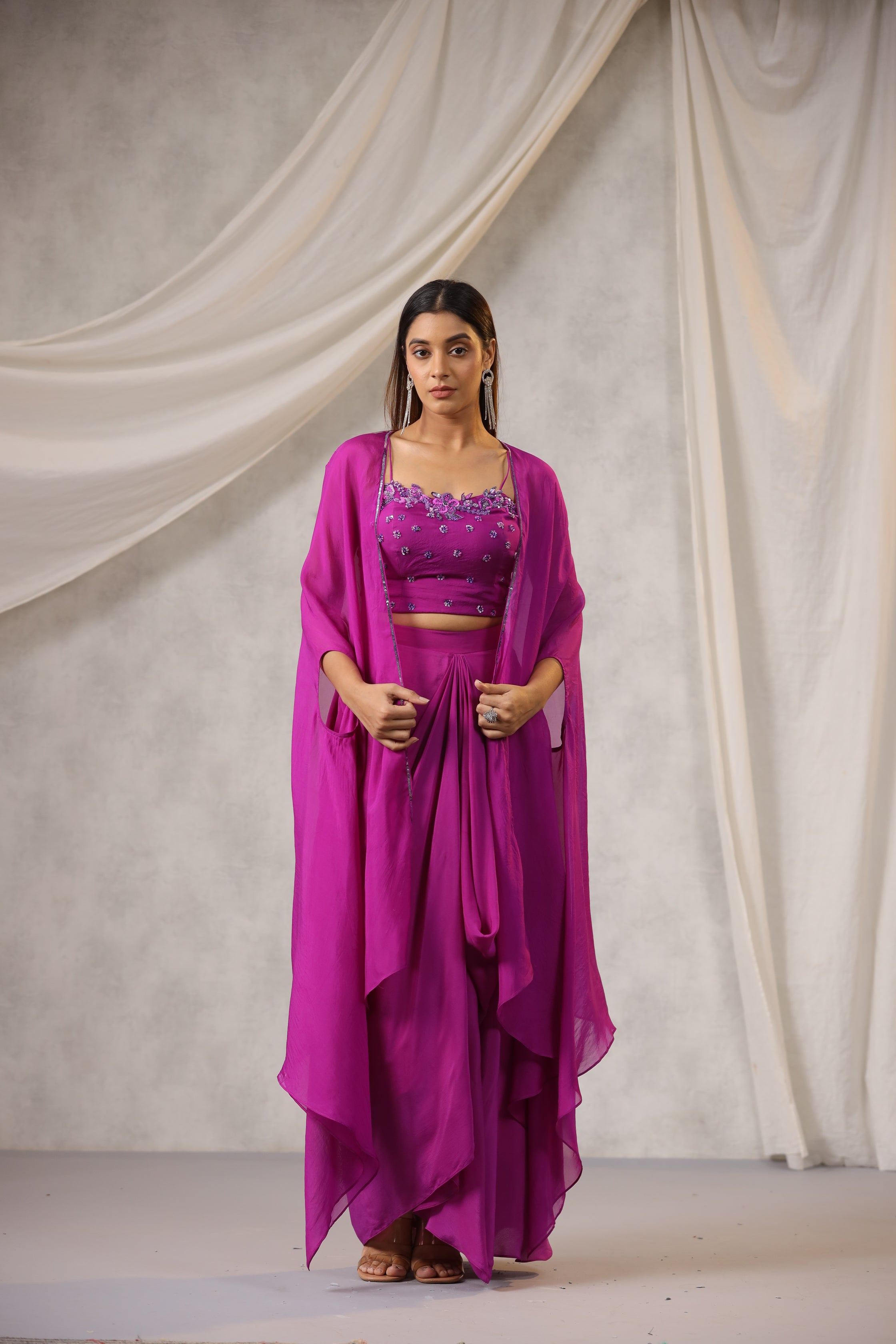 PURPLE EMBROIDERED BUSTIER WITH DRAPED SKIRT AND ORGANZA CAPE AND HAND WORK EDGING