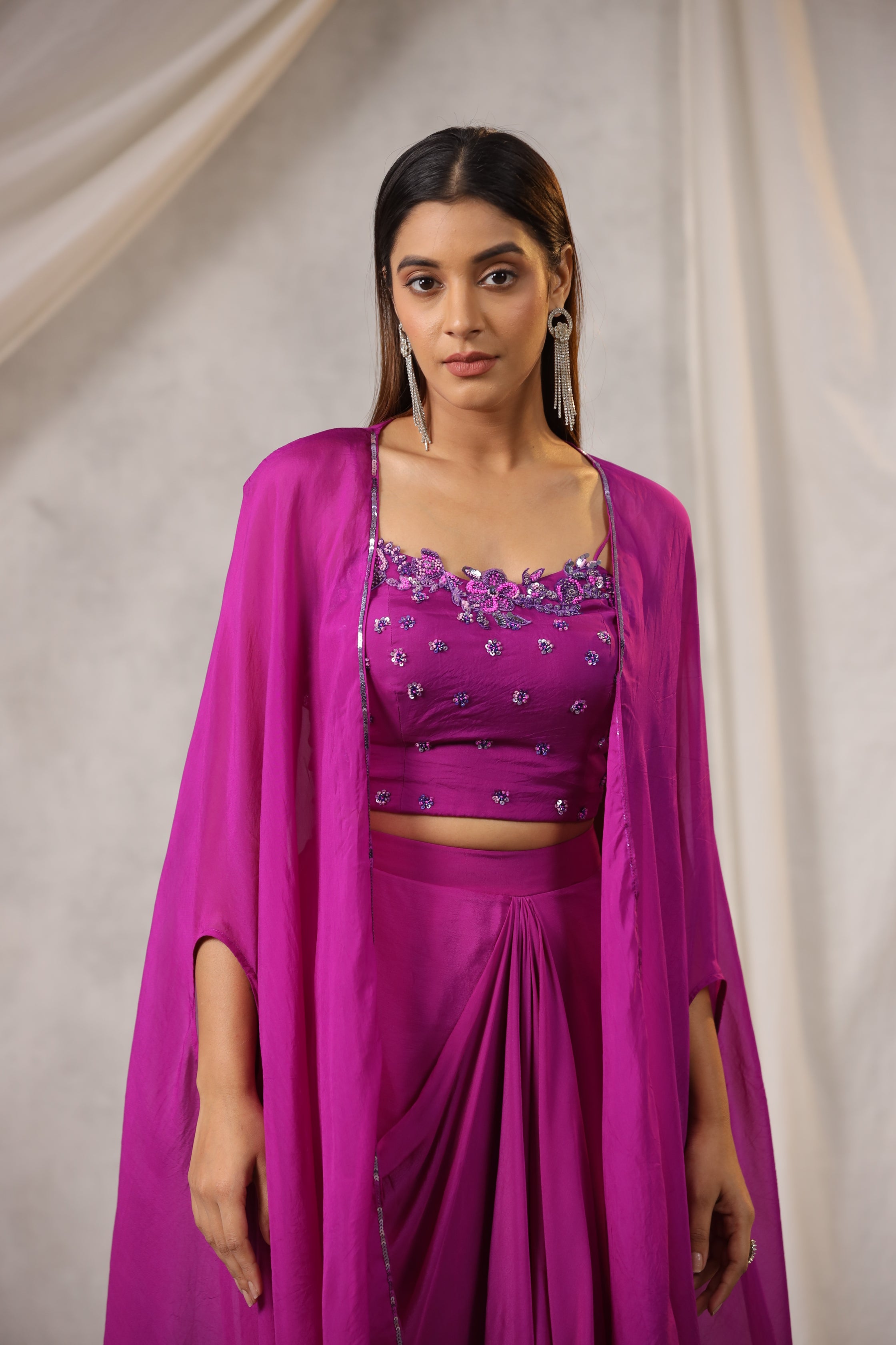 PURPLE EMBROIDERED BUSTIER WITH DRAPED SKIRT AND ORGANZA CAPE AND HAND WORK EDGING