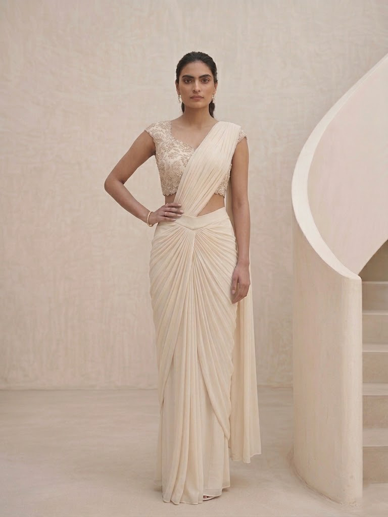 OFF WHITE DRAPE SAREE WITH APPLIQUE FLORAL WORK BLOUSE.