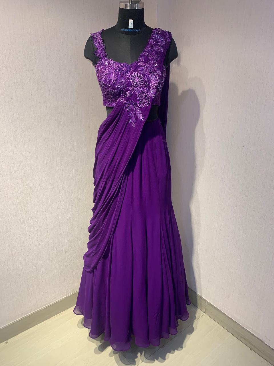 THE DELICATE FLORAL EMBROIDERY ON THIS DRAPE SAREE ADDS A TOUCH OF ELEGANCE AND CHARM.