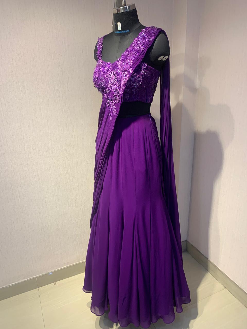 THE DELICATE FLORAL EMBROIDERY ON THIS DRAPE SAREE ADDS A TOUCH OF ELEGANCE AND CHARM.