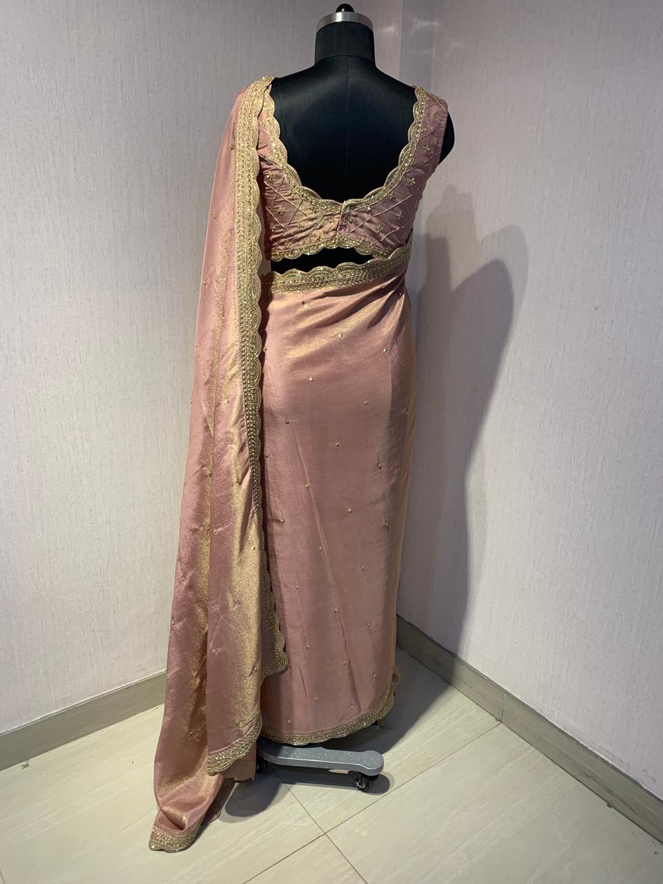 ELEGANT PINK SAREE WITH GOLDEN BORDER AND STYLISH BLOUSE.