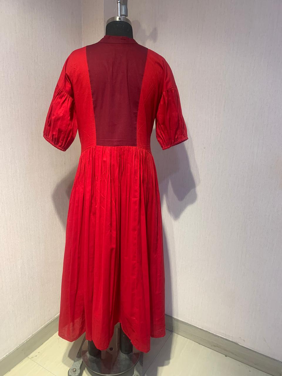 RED FLARED MIDI DRESS WITH PUFF SLEEVES AND EMBROIDERED YOKE.