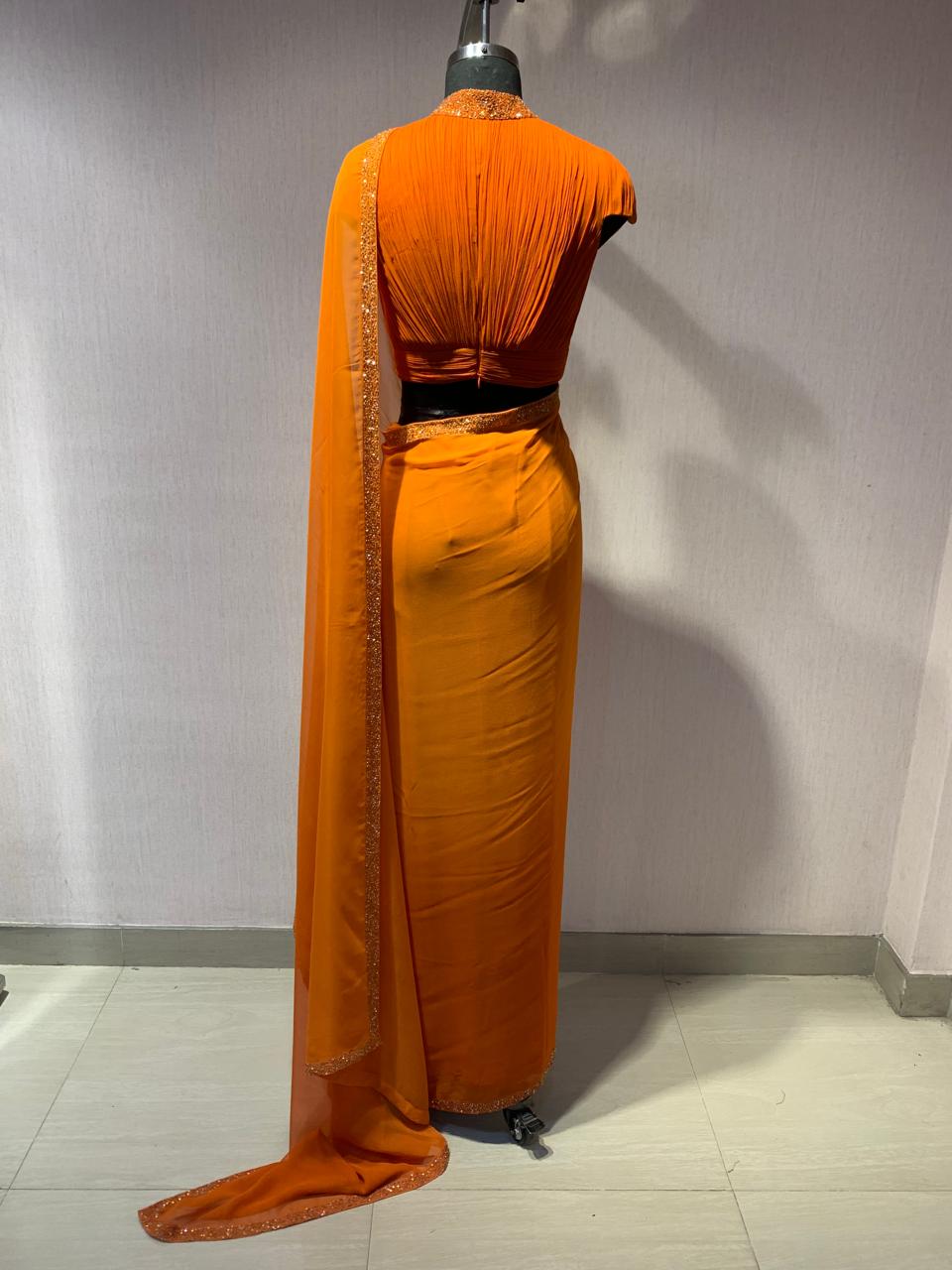 ORANGE DRAPED BLOUSE WITH OMBRE  SAREE.