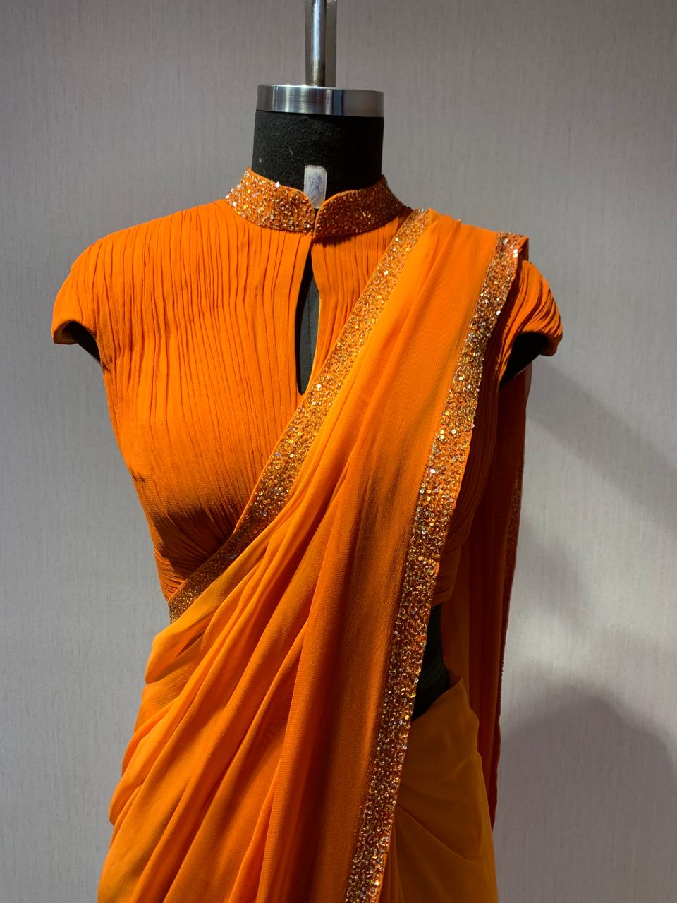 ORANGE DRAPED BLOUSE WITH OMBRE  SAREE.