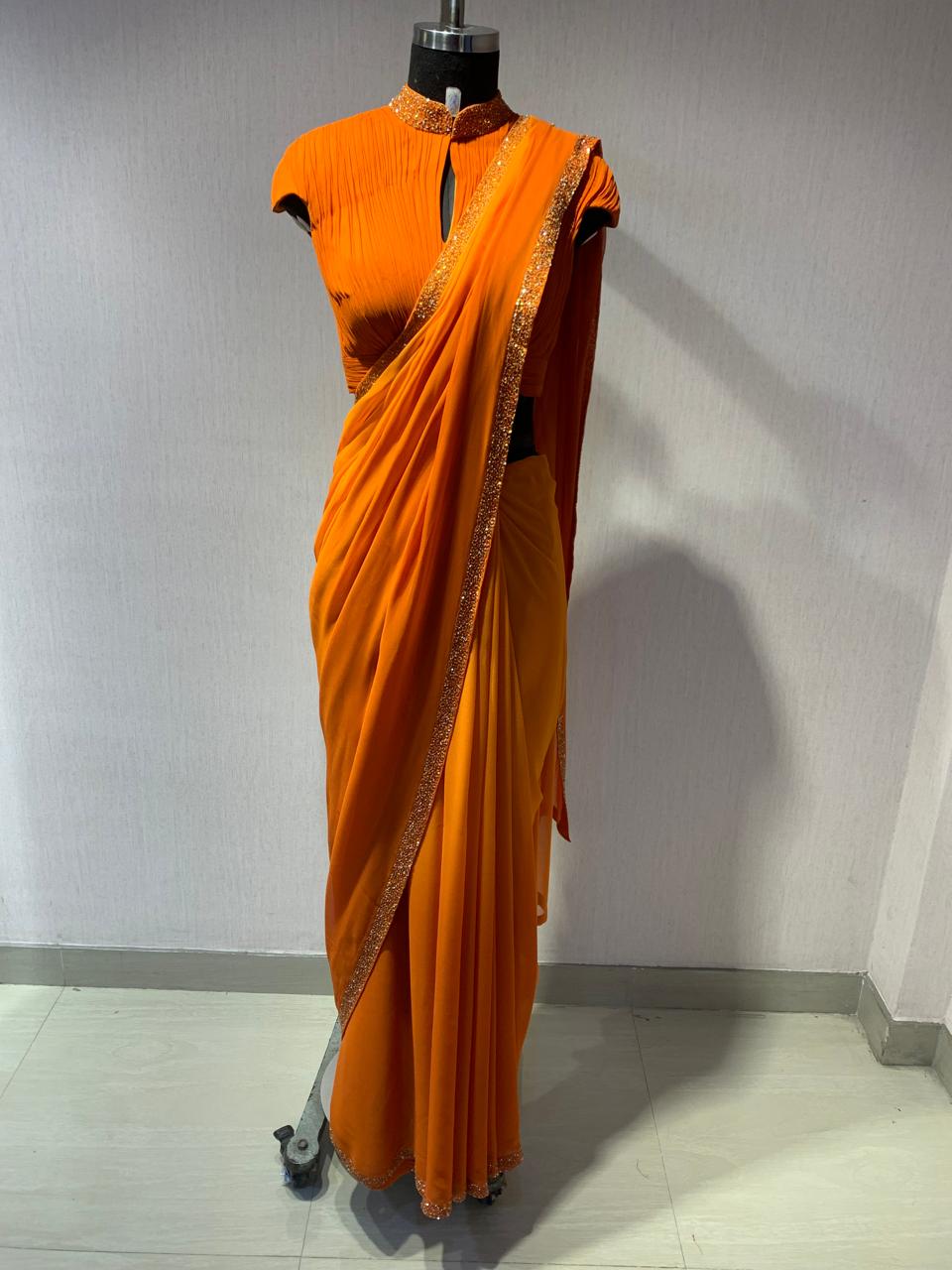 ORANGE DRAPED BLOUSE WITH OMBRE  SAREE.