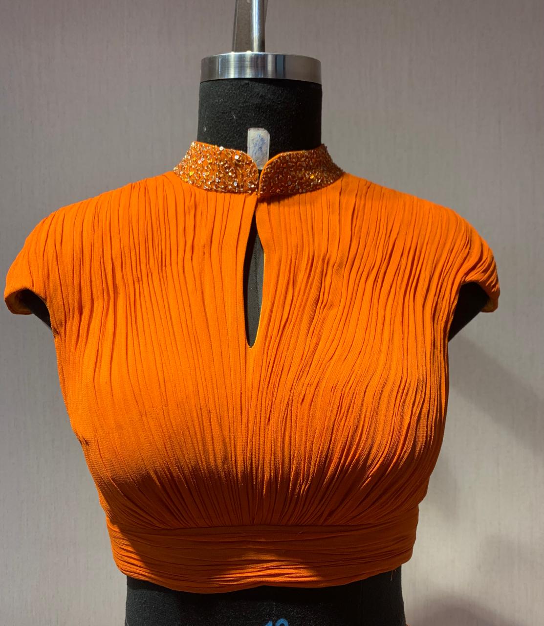 ORANGE DRAPED BLOUSE WITH OMBRE  SAREE.