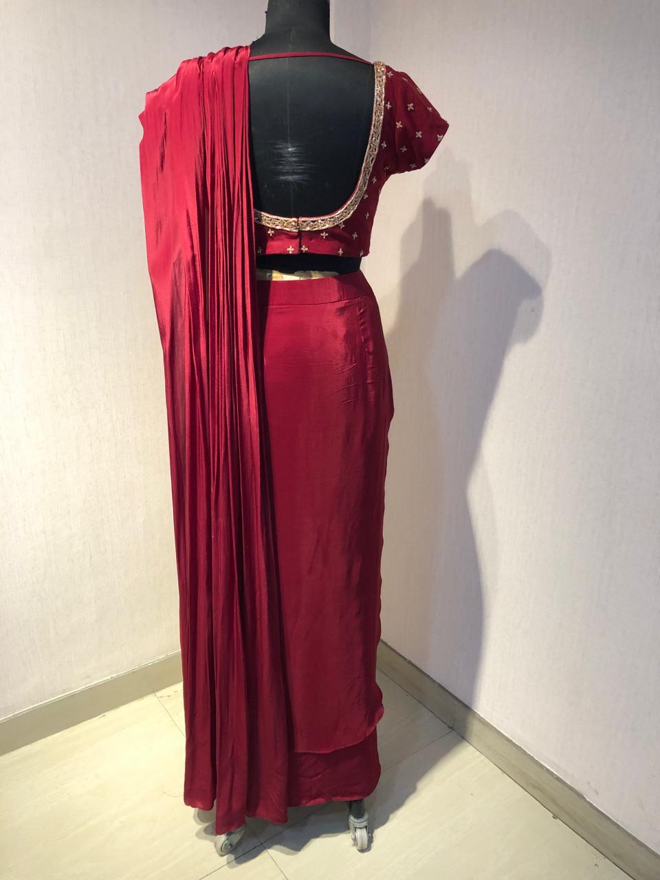 RED DRAPE SAREE WITH EMBRIODERED BLOUSE.