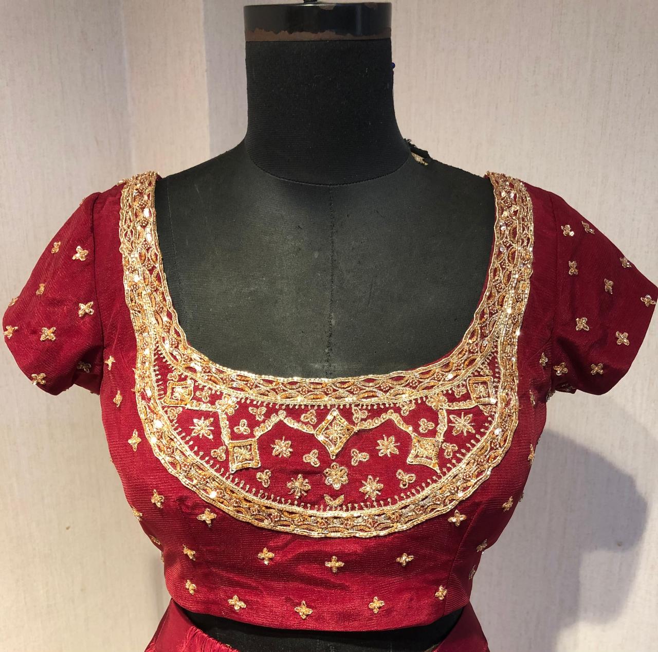 RED DRAPE SAREE WITH EMBRIODERED BLOUSE.