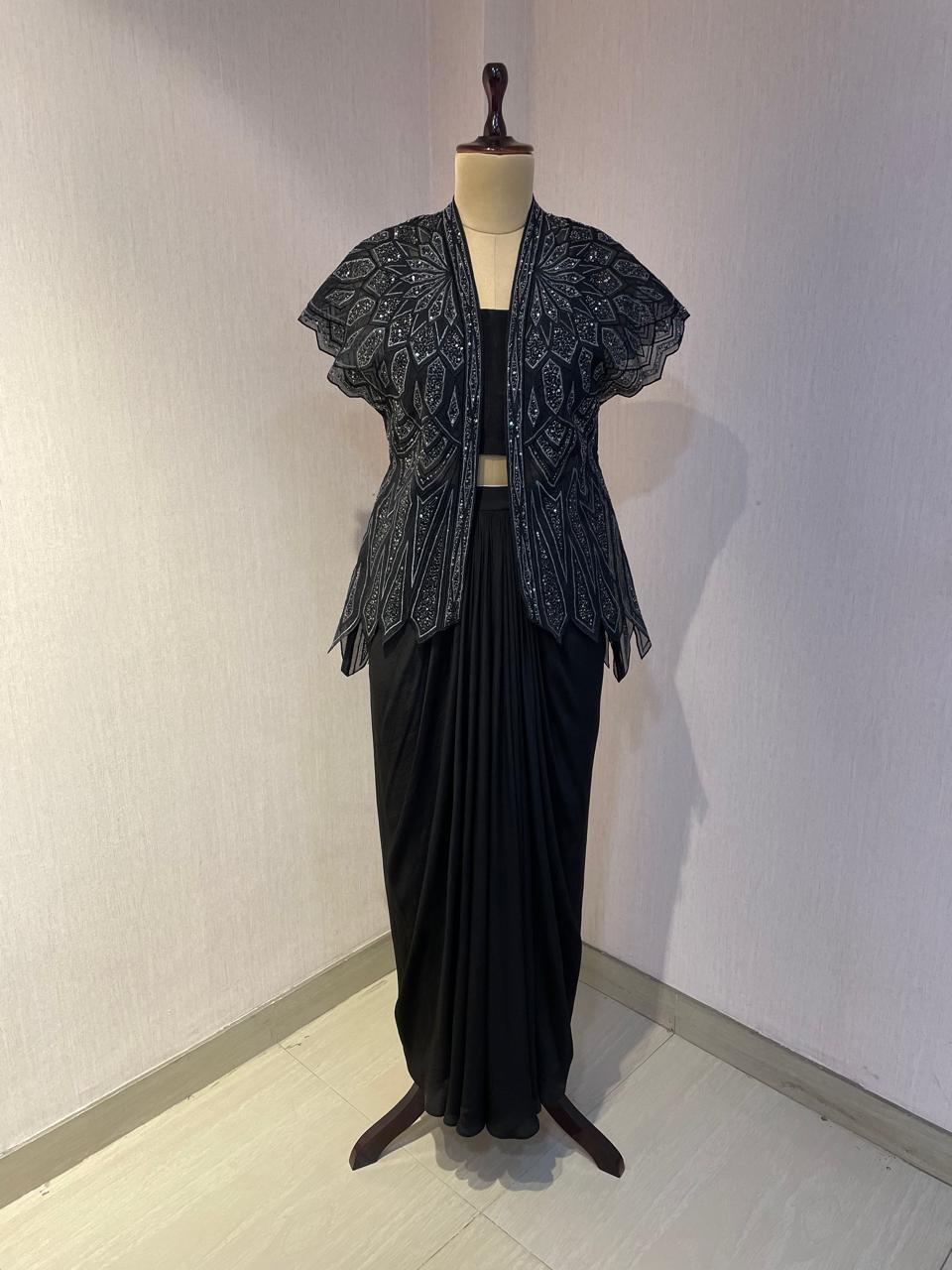 BLACK SKIRT & TOP WITH EMBELLISHED BELTED JACKET.