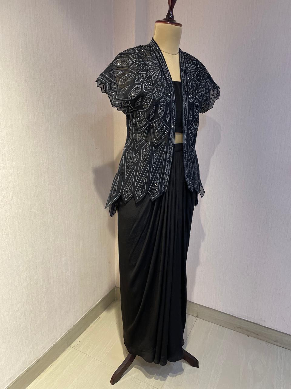 BLACK SKIRT & TOP WITH EMBELLISHED BELTED JACKET.