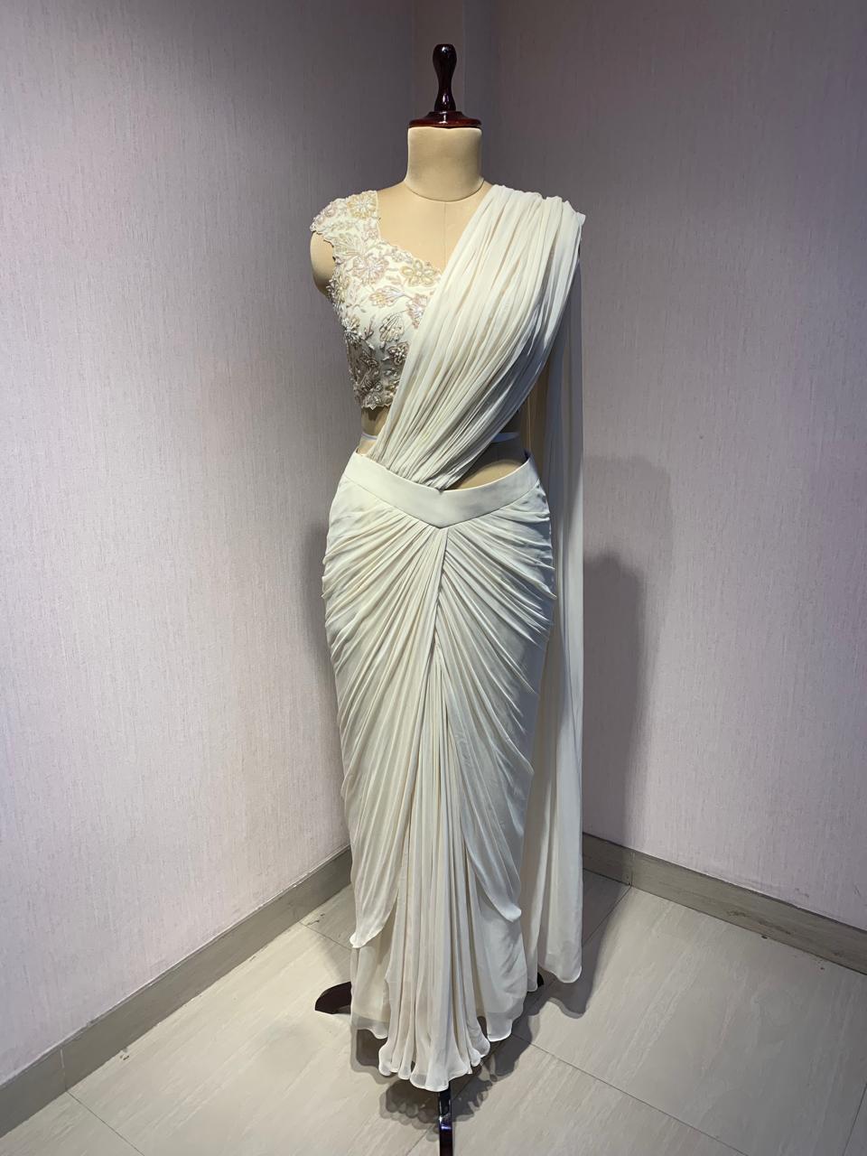 OFF WHITE DRAPE SAREE WITH APPLIQUE FLORAL WORK BLOUSE.