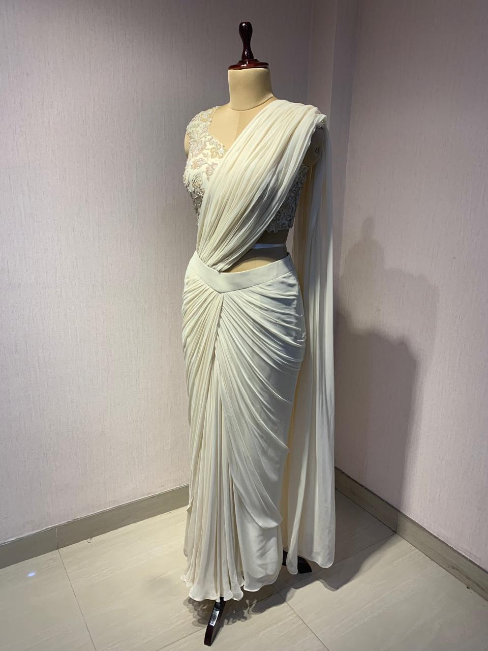 OFF WHITE DRAPE SAREE WITH APPLIQUE FLORAL WORK BLOUSE.