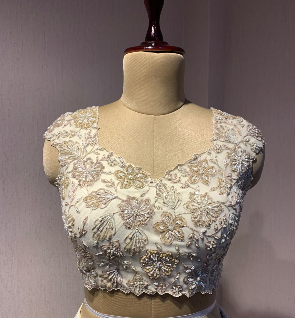 OFF WHITE DRAPE SAREE WITH APPLIQUE FLORAL WORK BLOUSE.