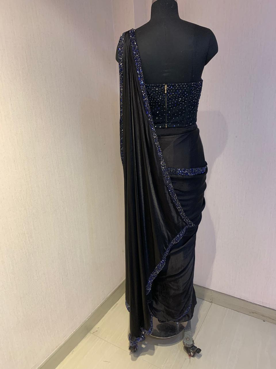 BLACK SEQUIN AND BEAD EMBELLISHED DRAPED SAREE WITH WIRE-WORK BUSTIER.