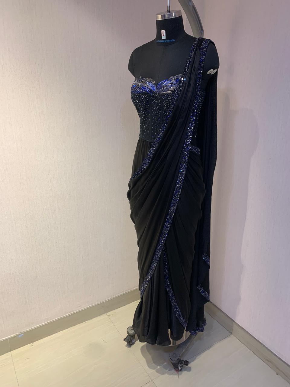 BLACK SEQUIN AND BEAD EMBELLISHED DRAPED SAREE WITH WIRE-WORK BUSTIER.