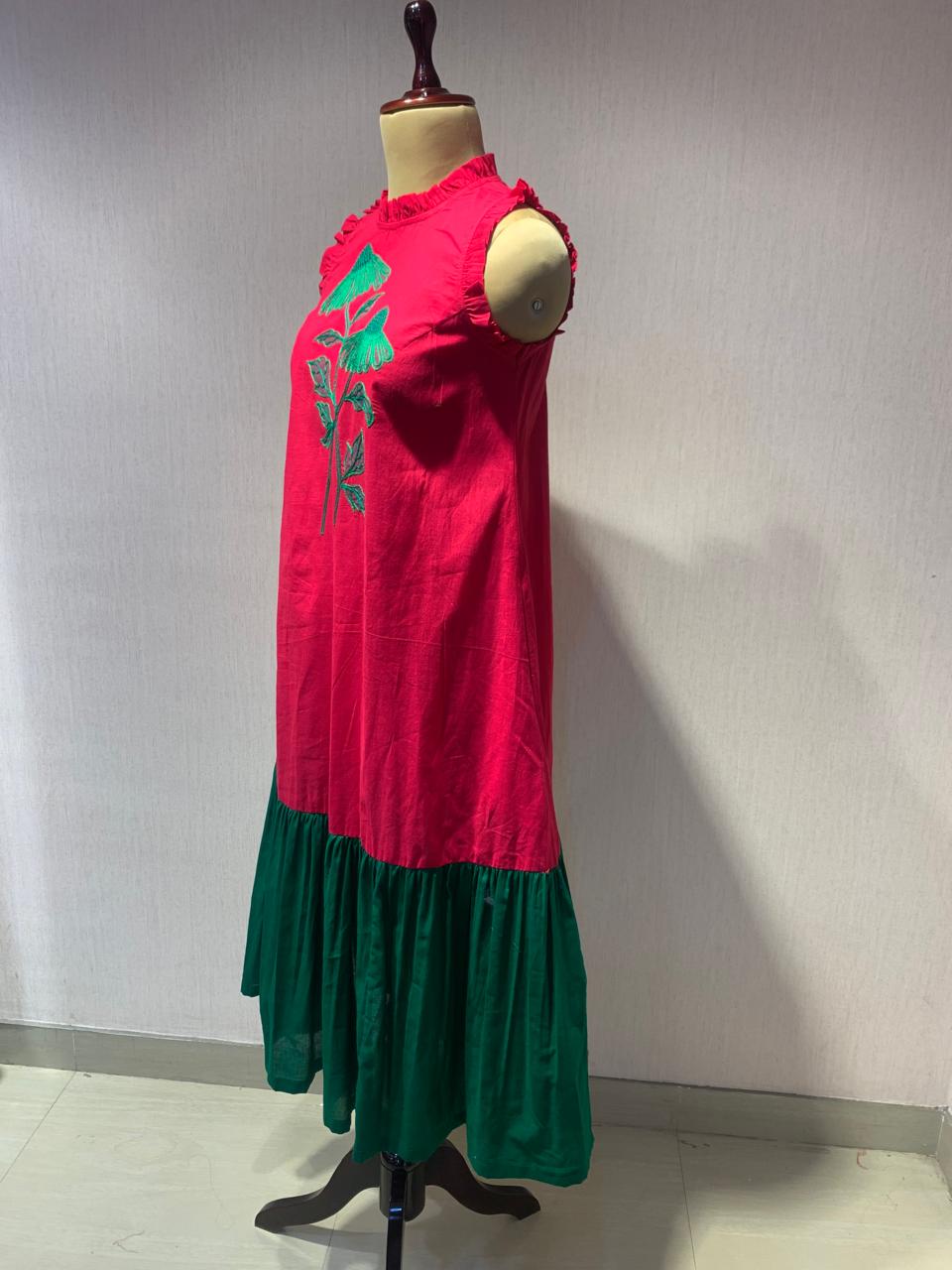 PINK GREEN HANDKERCHIEF HEM DRESS WITH FLORAL EMBROIDERY.