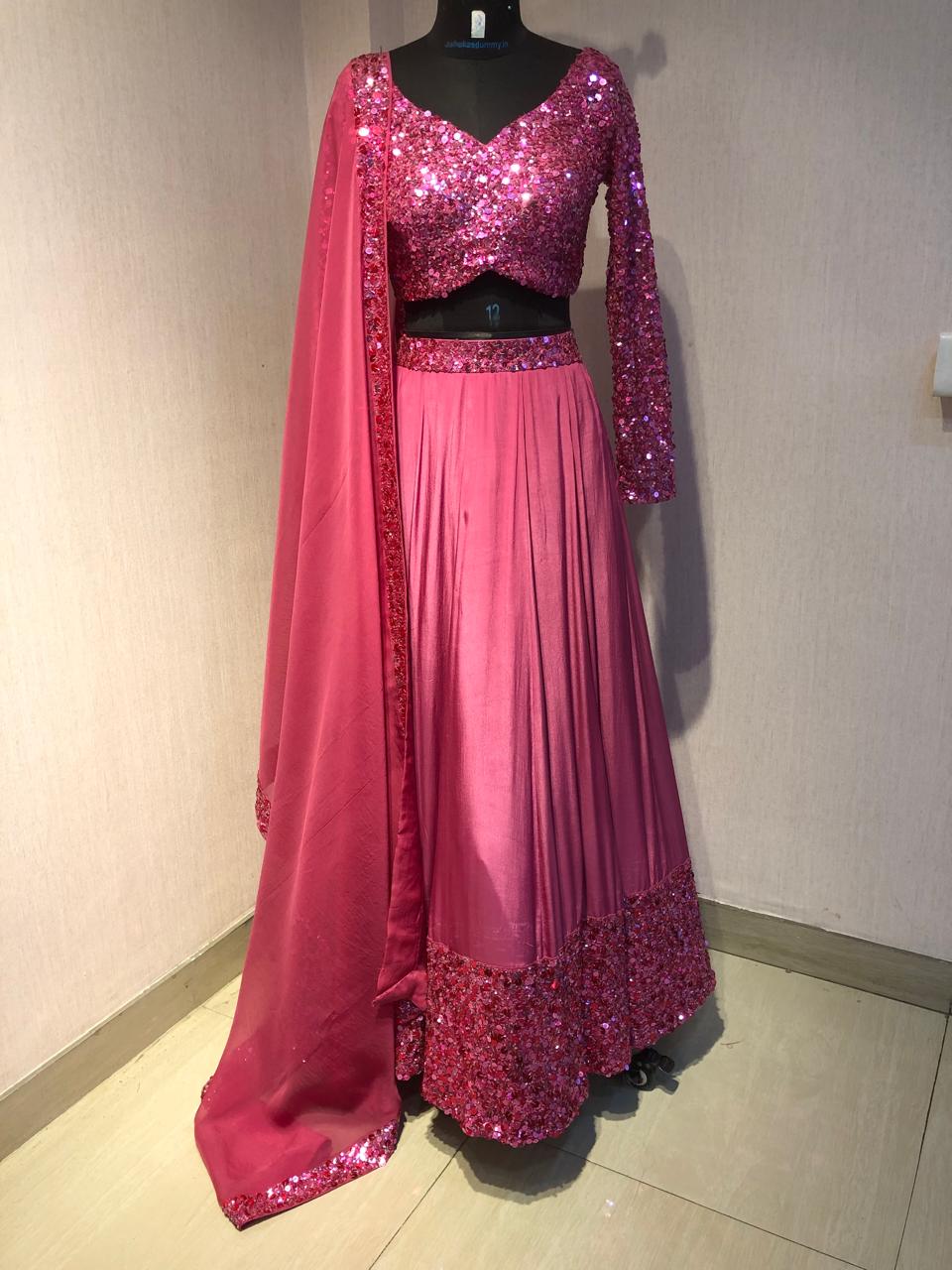 PINK SEQUIN EMBELLISHED LEHENGA SET WITH MATCHING BLOUSE AND DUPATTA.