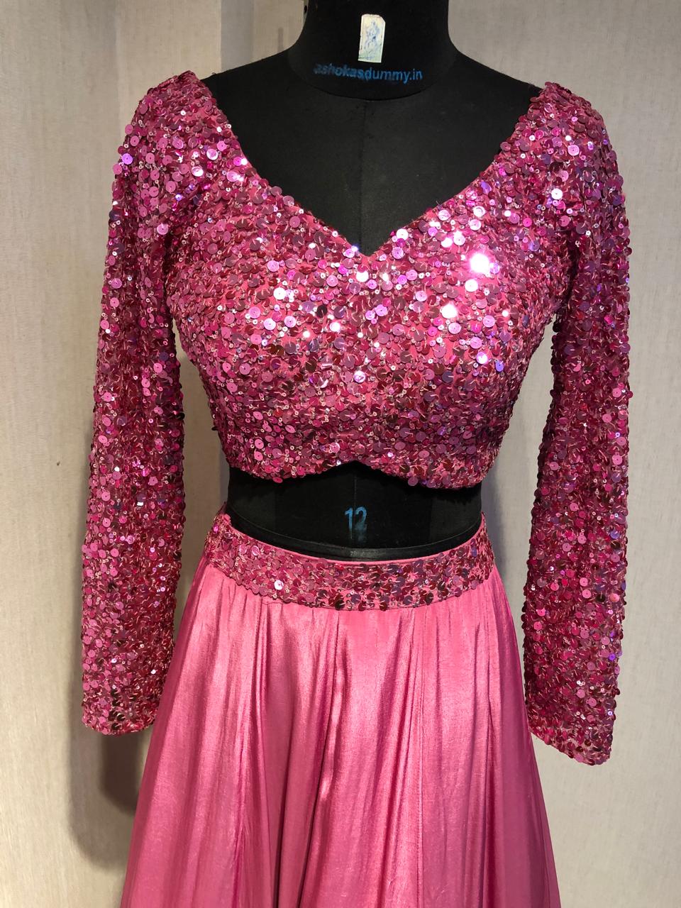 PINK SEQUIN EMBELLISHED LEHENGA SET WITH MATCHING BLOUSE AND DUPATTA.