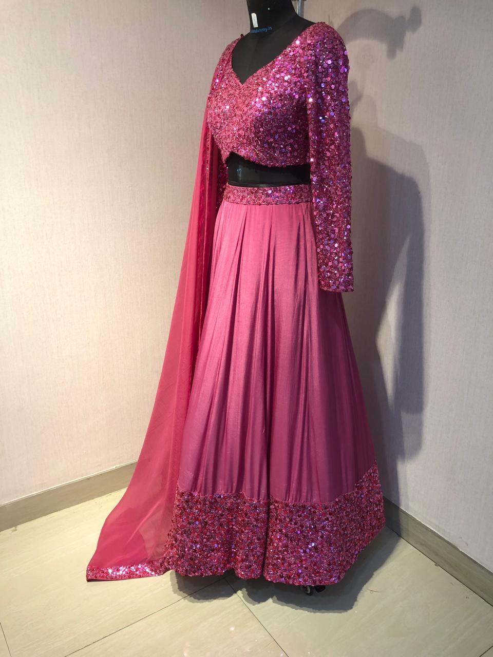 PINK SEQUIN EMBELLISHED LEHENGA SET WITH MATCHING BLOUSE AND DUPATTA.