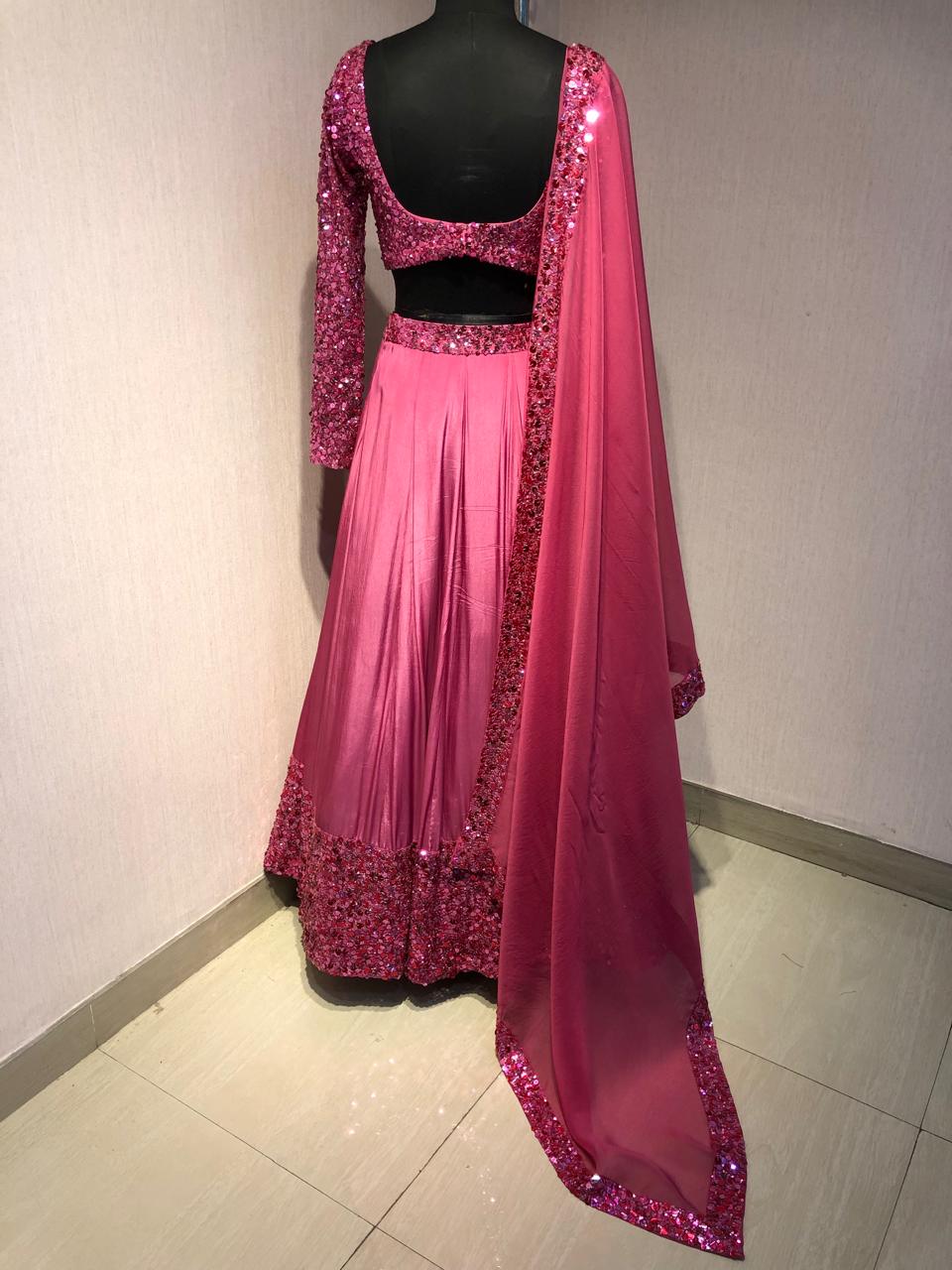 PINK SEQUIN EMBELLISHED LEHENGA SET WITH MATCHING BLOUSE AND DUPATTA.