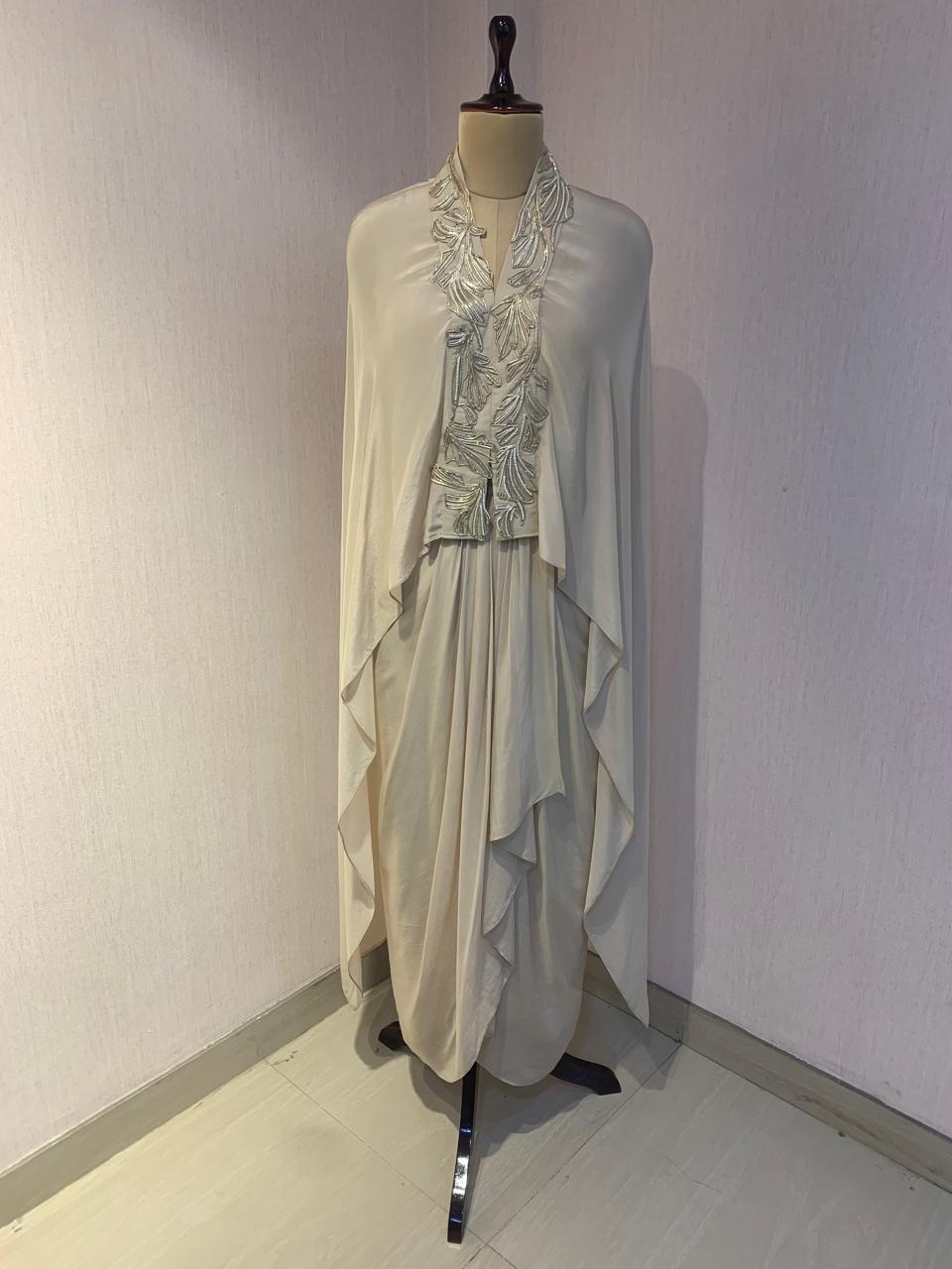 WIRE EMBELLISHED LAYERED TOP WITH INNER AND DRAPED SKIRT.