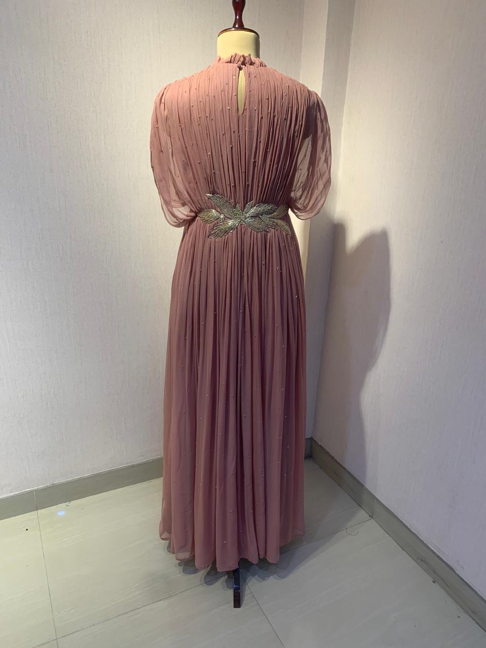 DUSTY ROSE SEQUIN AND WIRE EMBELLISHED PLEATED GOWN WITH SHEER SLEEVES.