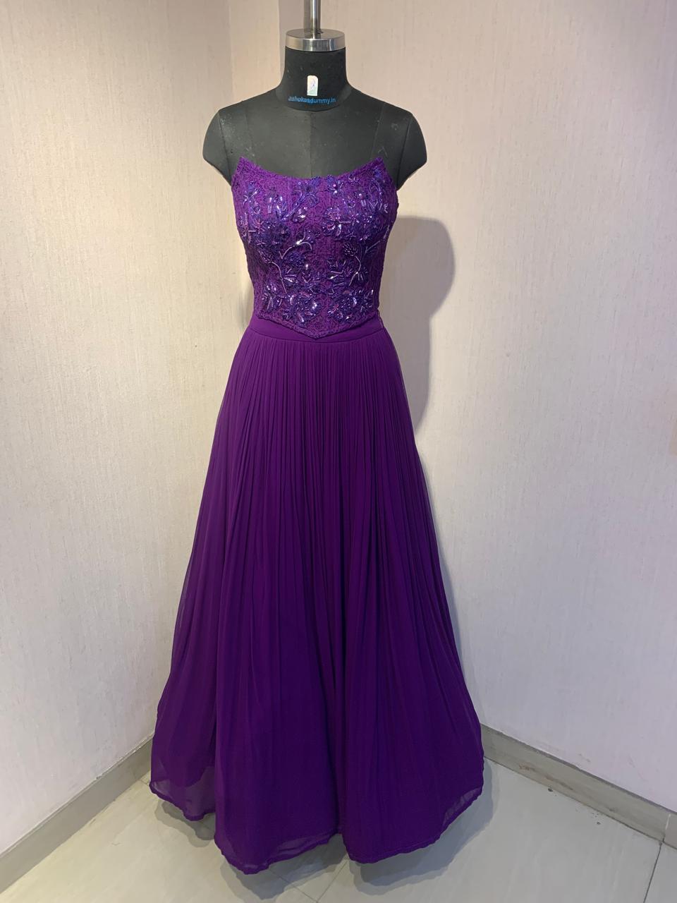 PURPLE EMBROIDERED CORSET TOP WITH FLARED SKIRT AND CAPE.